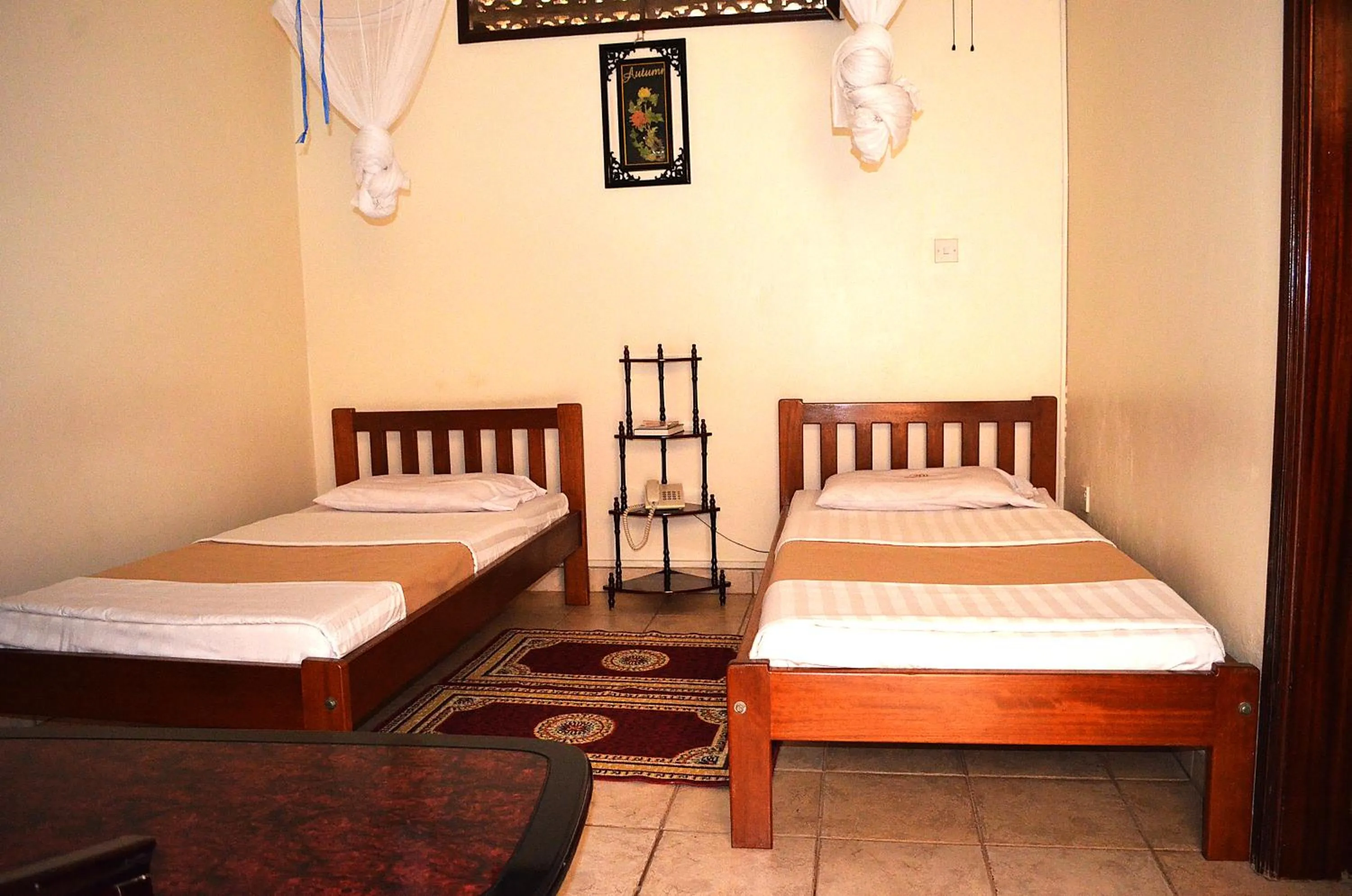 Bed in Victoria Travel Hotel