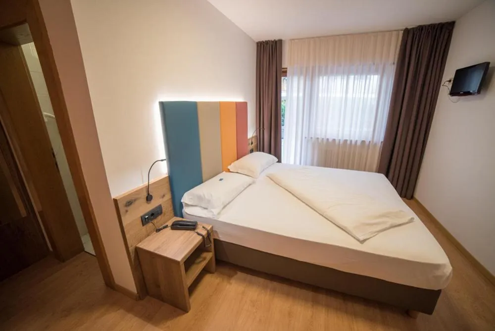 Bed in Olimpionico Hotel