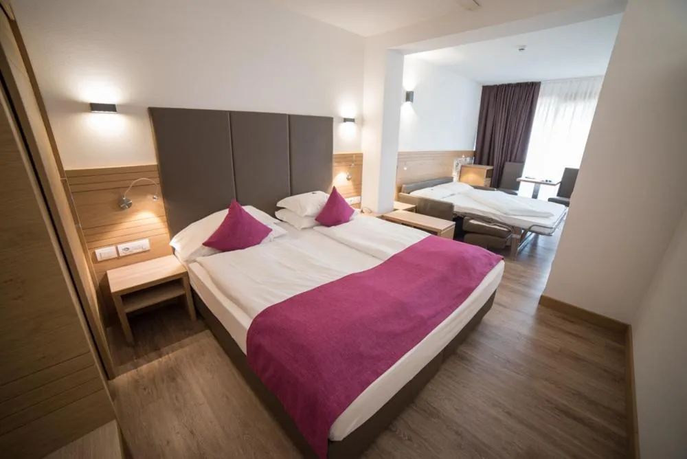 Bed in Olimpionico Hotel