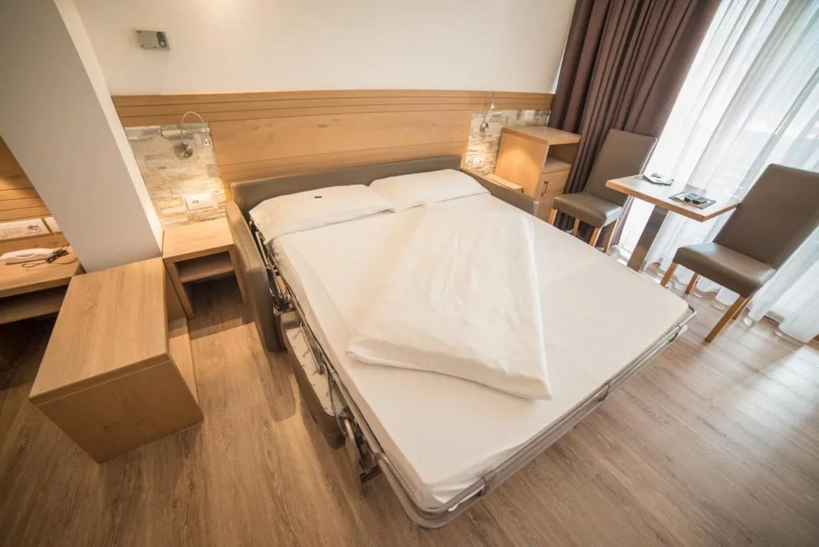 Bed in Olimpionico Hotel