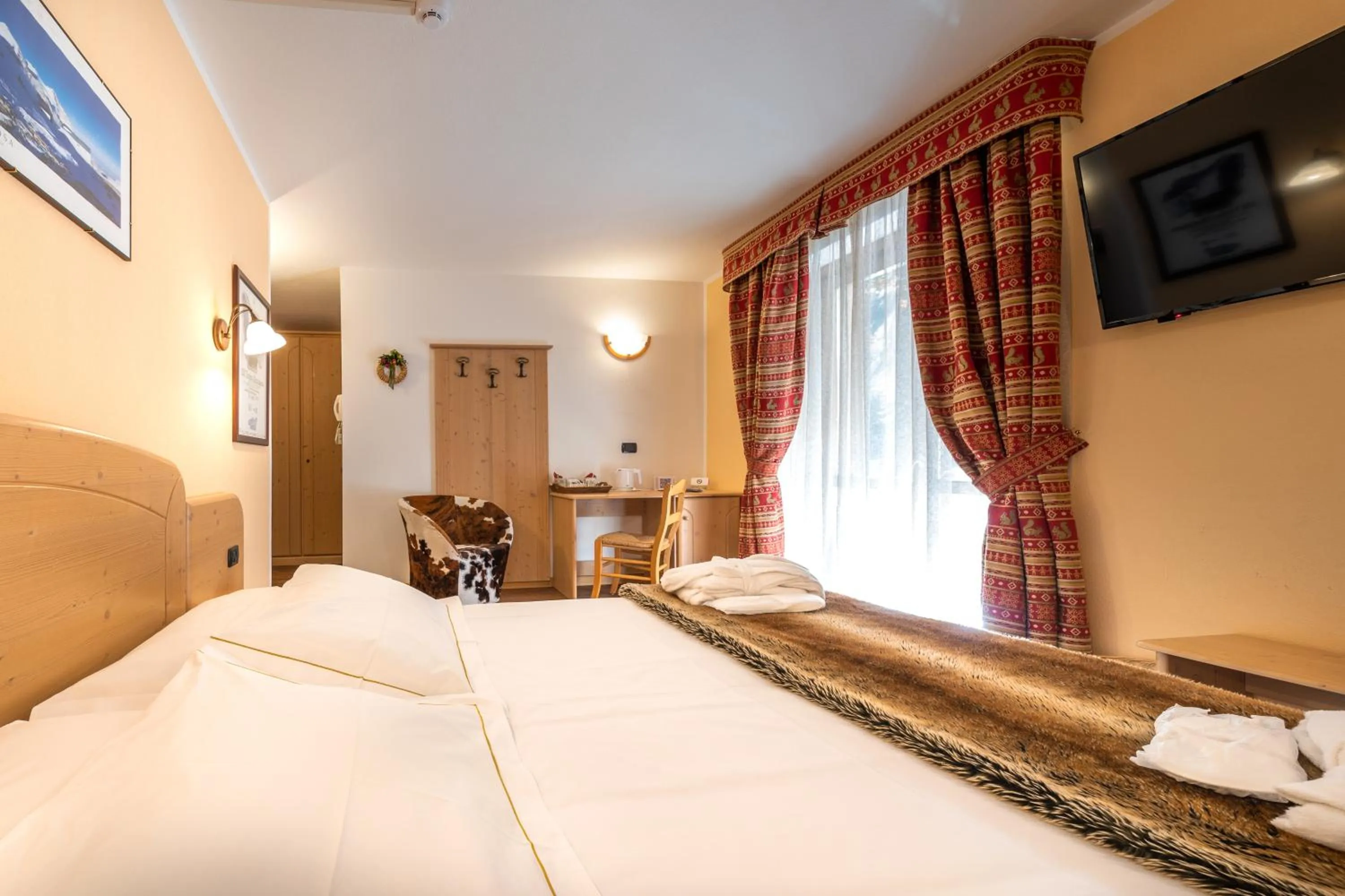 Bed in Lo Scoiattolo Hotel