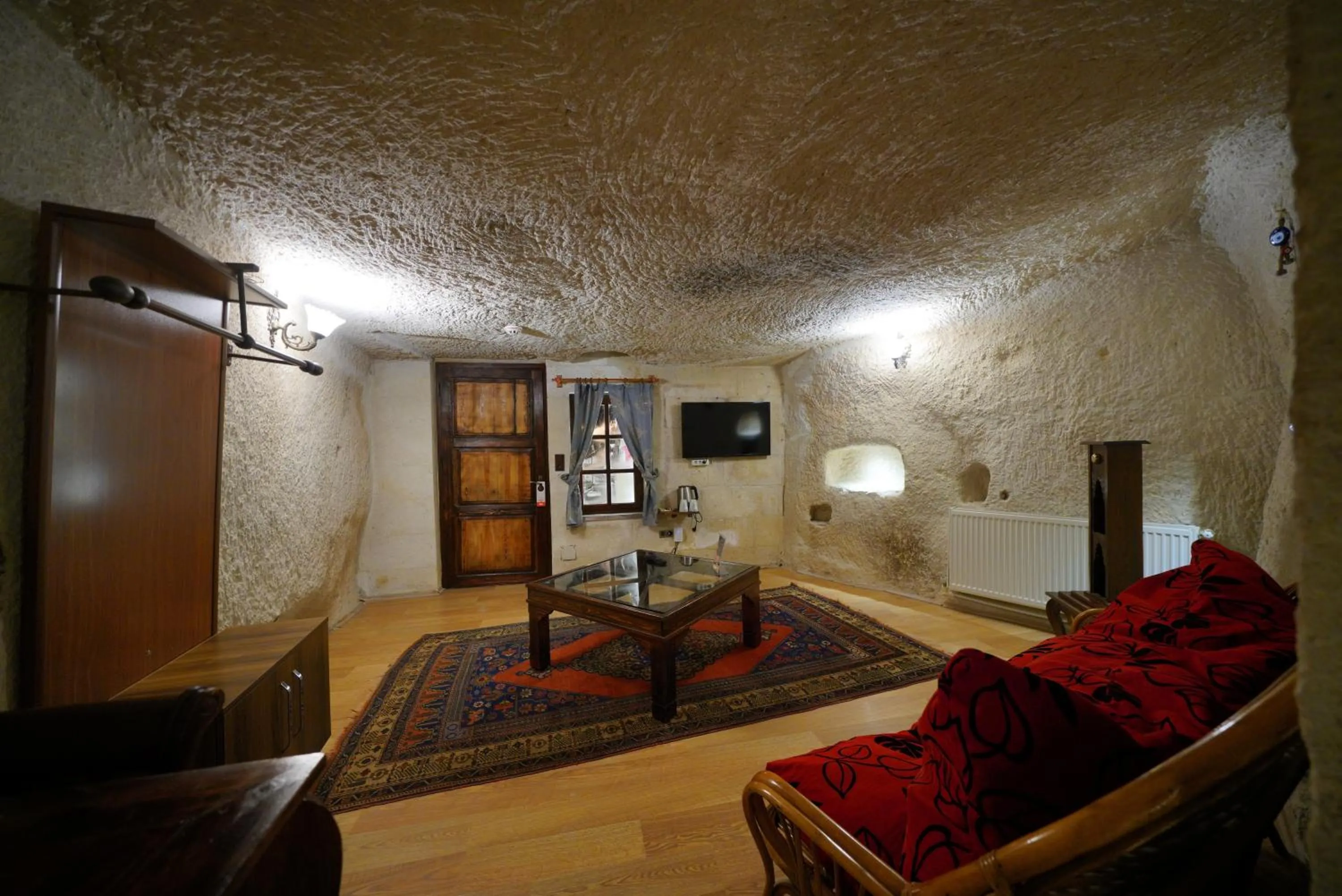Living room, Bed in Asteria Cave Hotel