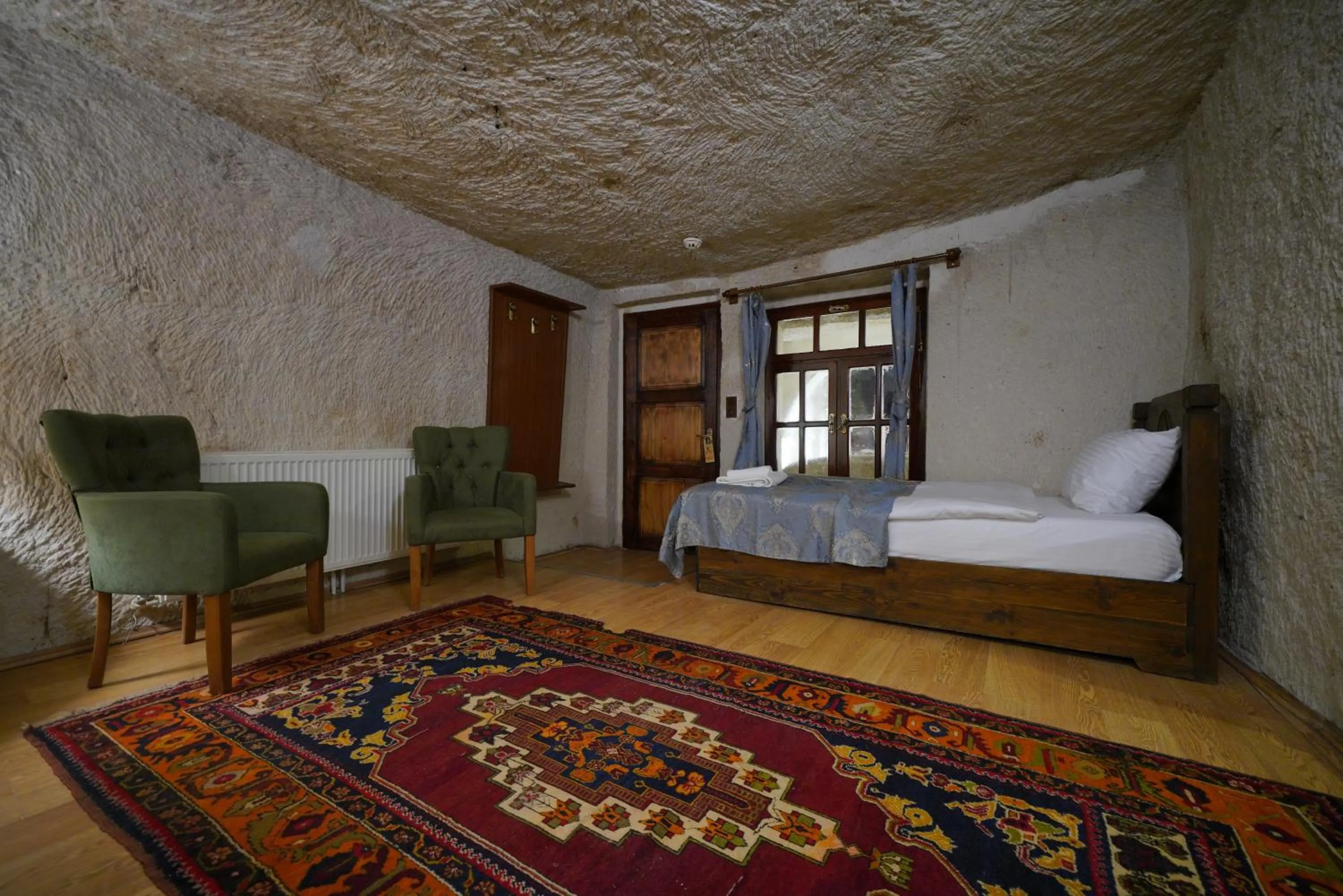 Living room, Bed in Asteria Cave Hotel