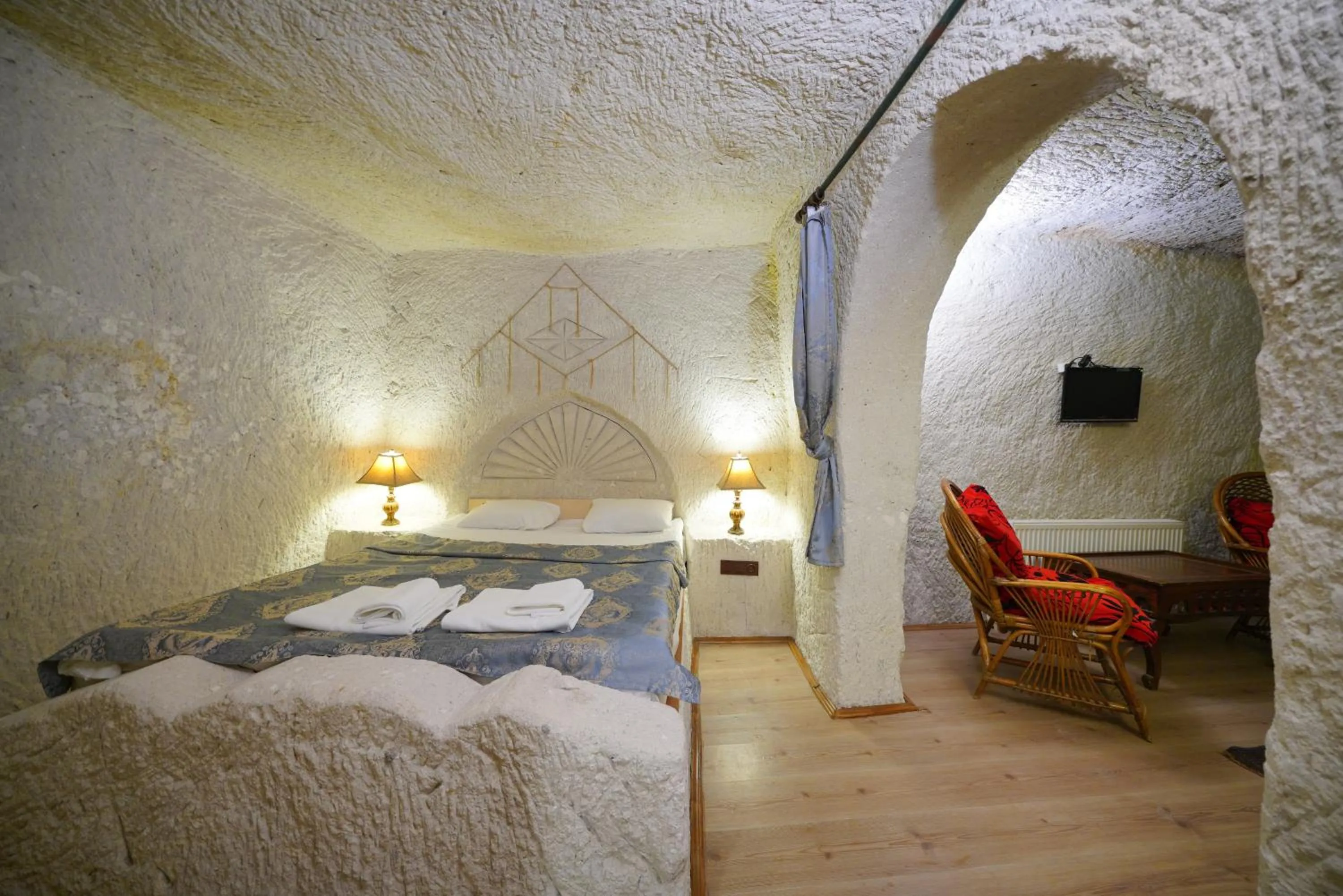 Living room, Bed in Asteria Cave Hotel