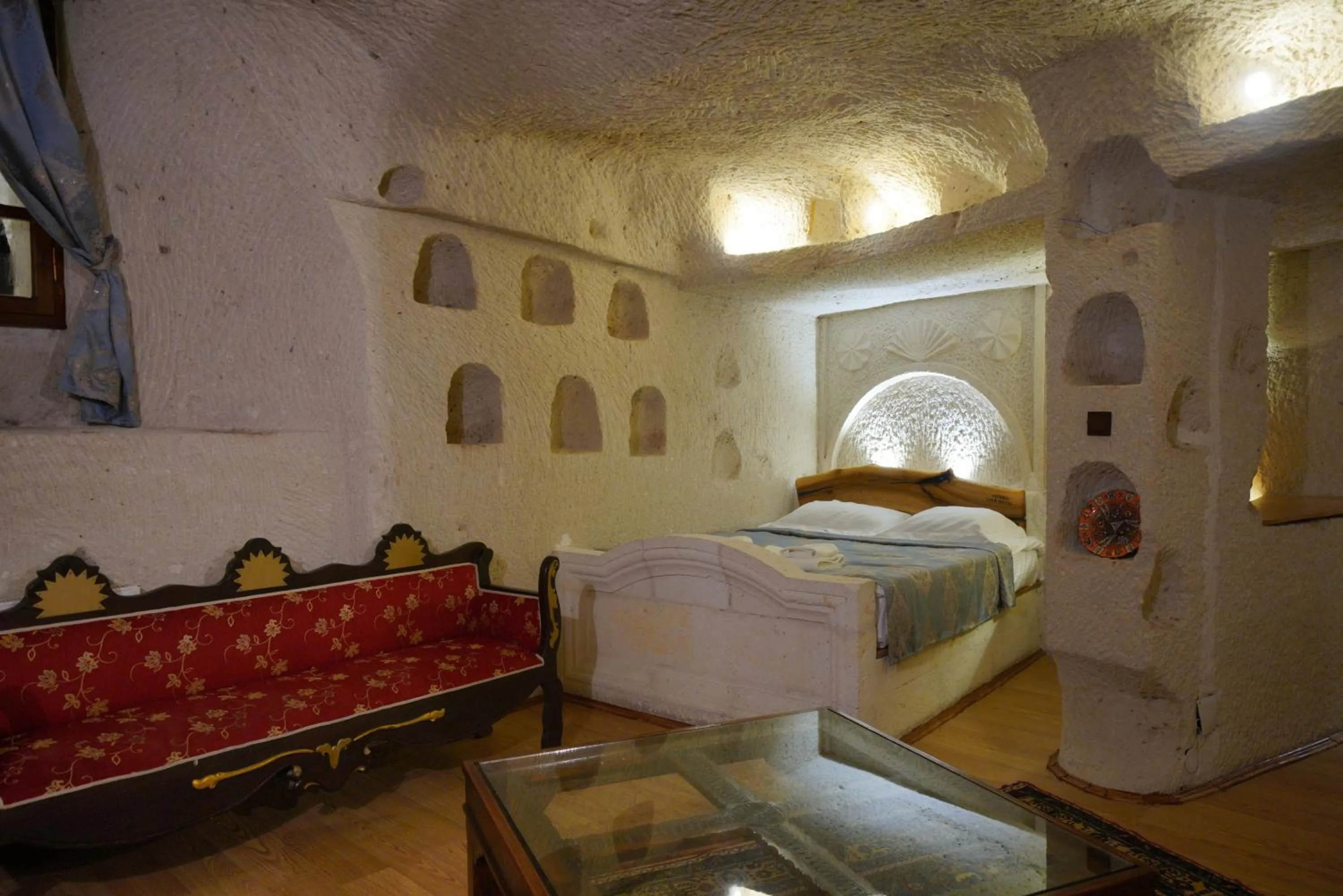 Living room, Bed in Asteria Cave Hotel