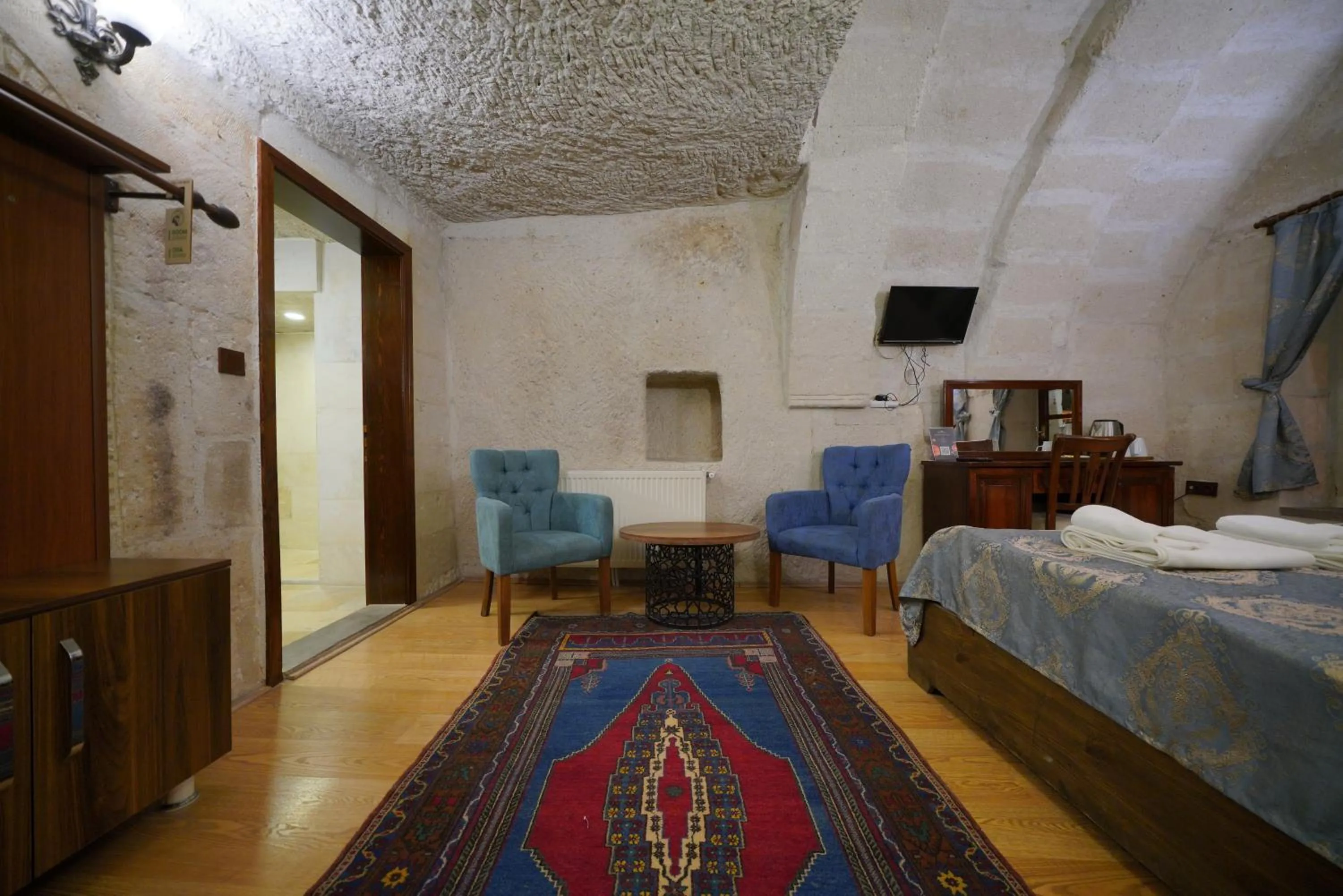 Living room, Bed in Asteria Cave Hotel