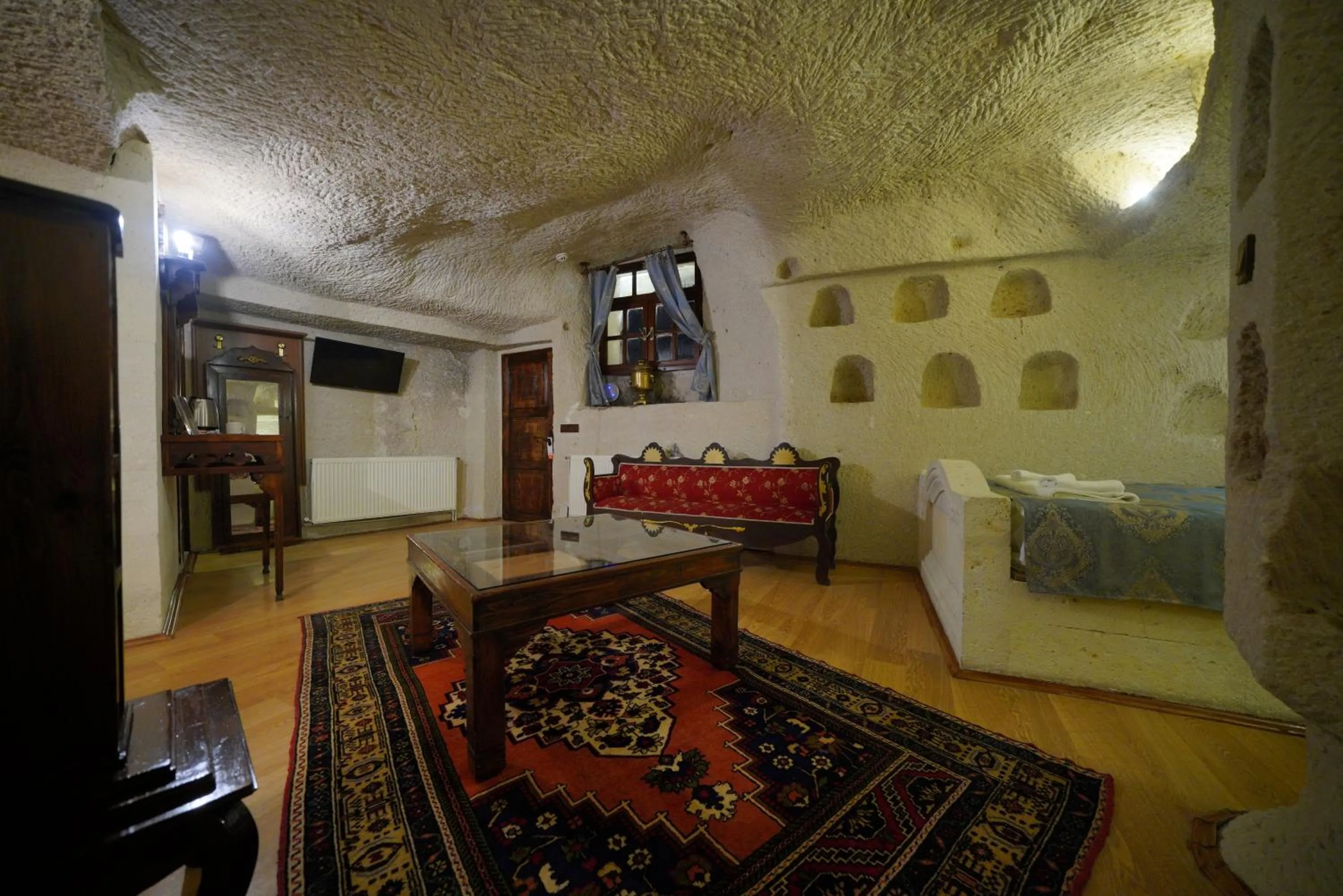 Living room, Bed in Asteria Cave Hotel