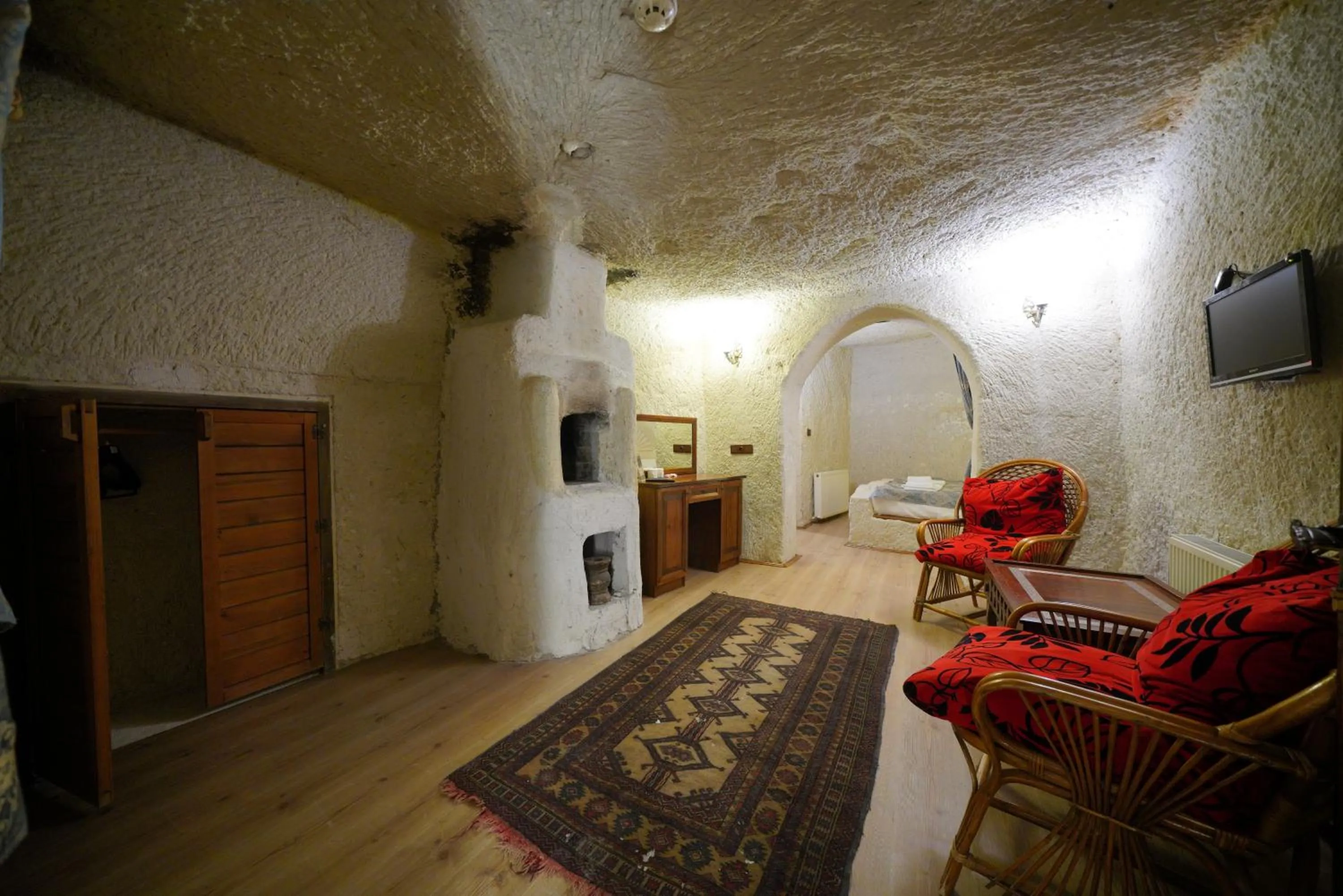 Living room, Bed in Asteria Cave Hotel