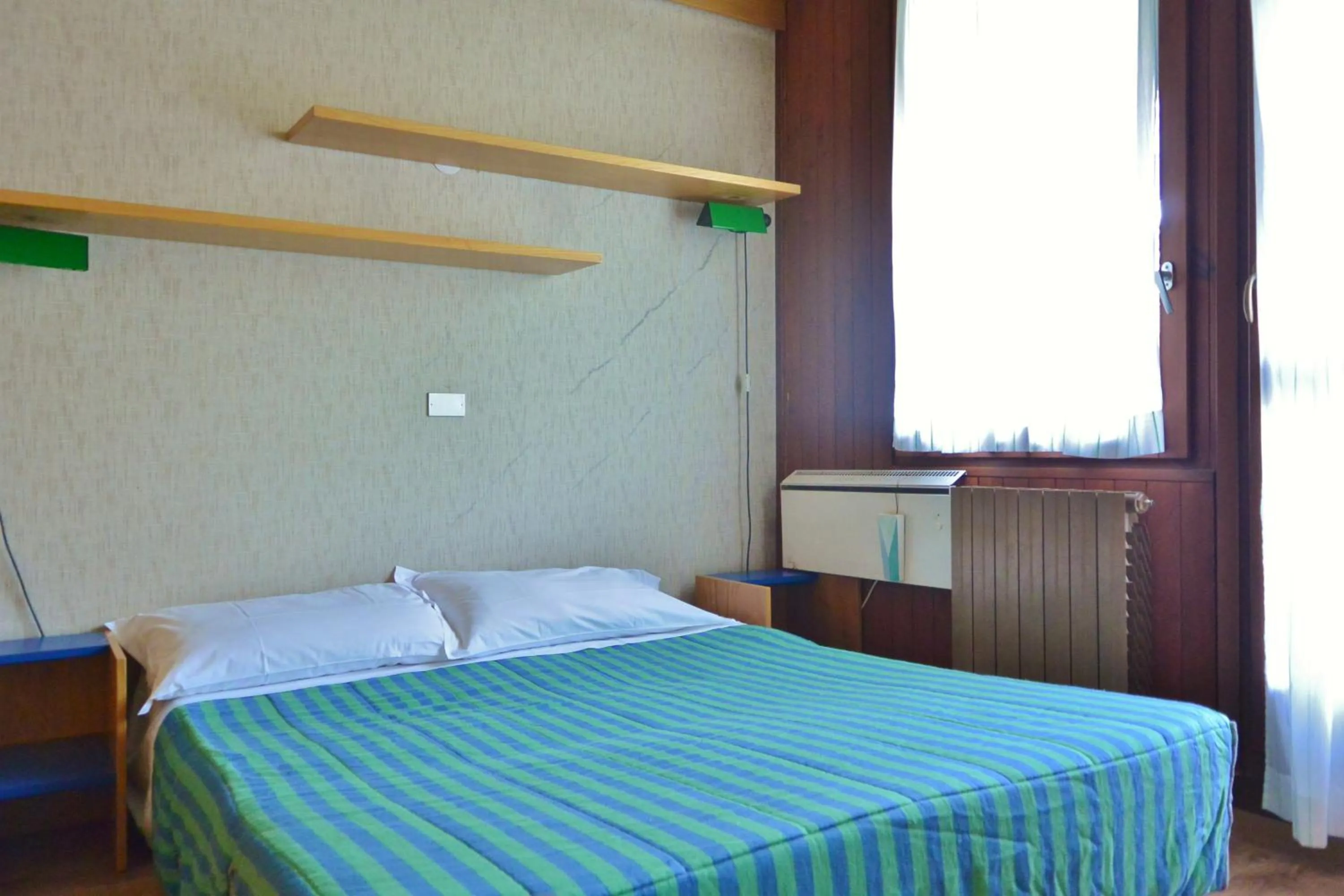 Bed in Appartamenti La Maison de Vacances