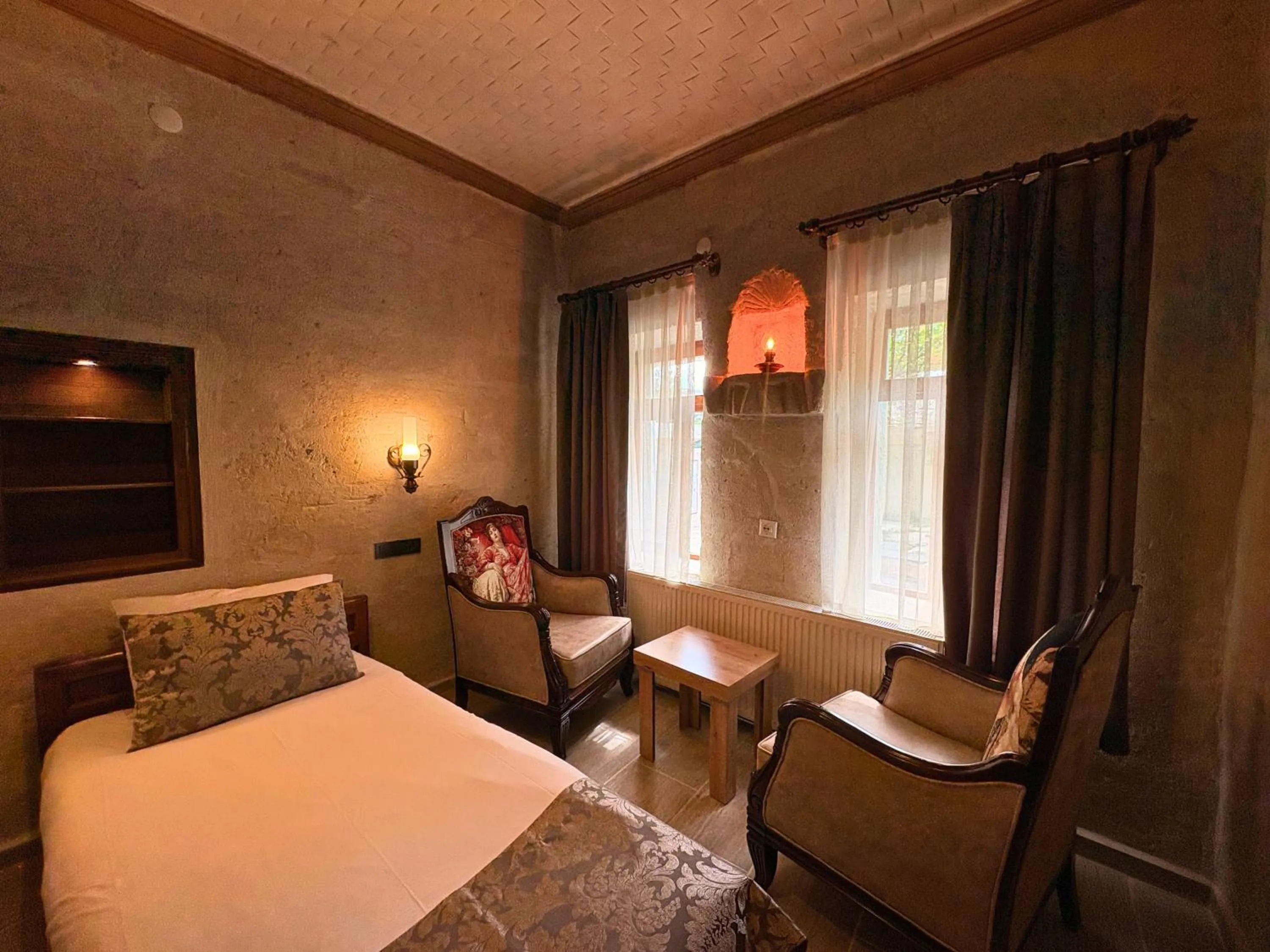 Seating area, Bed in Elysee Cave House