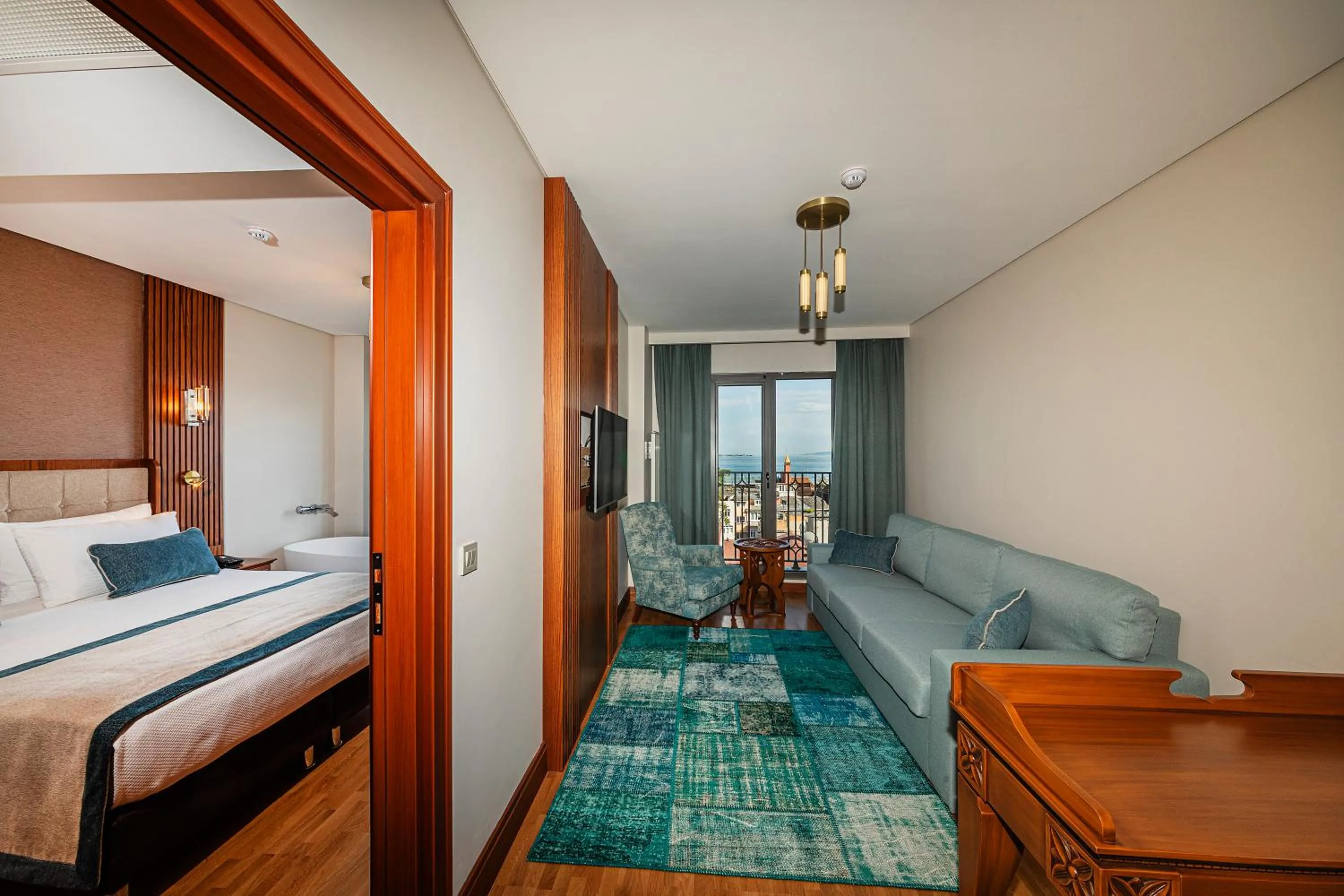 Living room, Bed in Triton Hotel