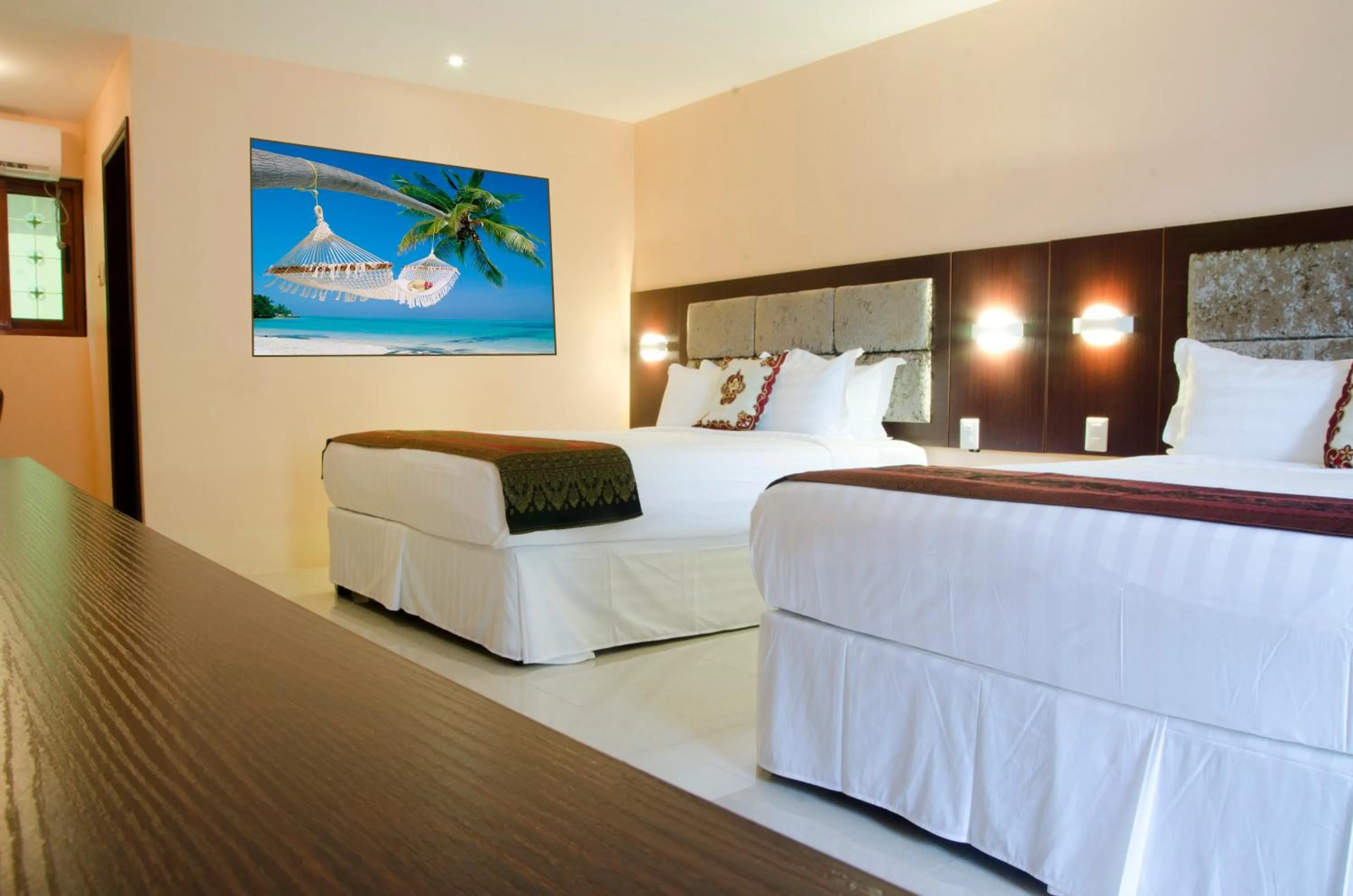 Bed in Grand Diamond Hotel Trinidad