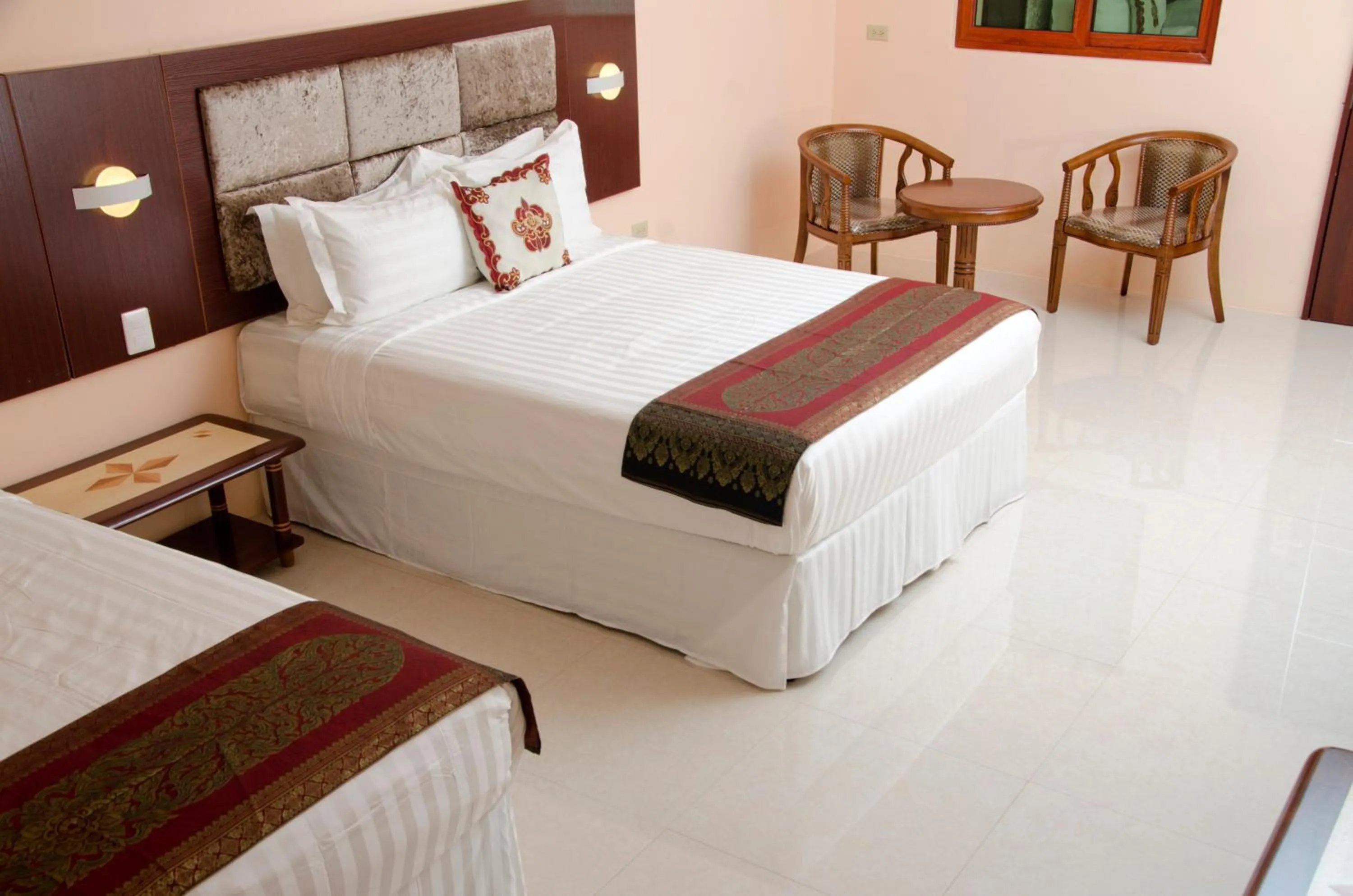 Bed in Grand Diamond Hotel Trinidad