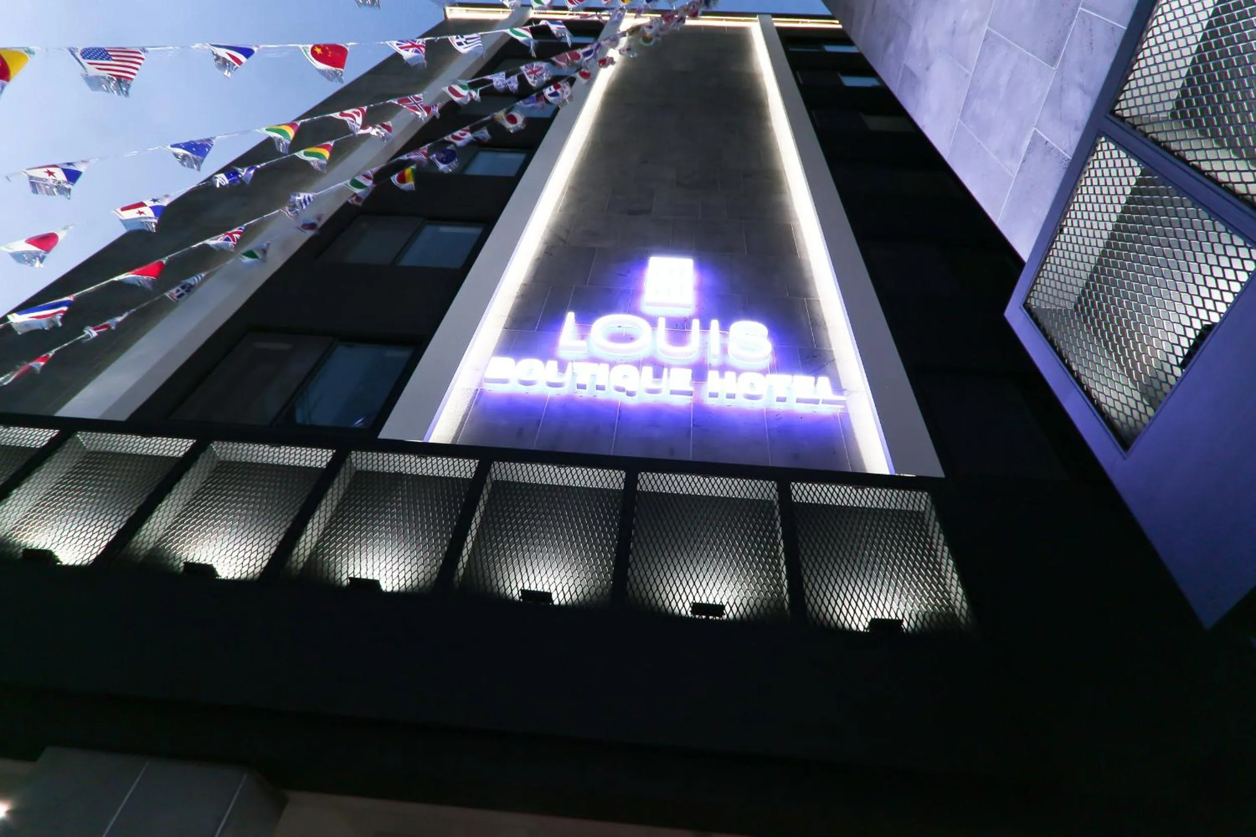 Property logo or sign in Louis Hotel