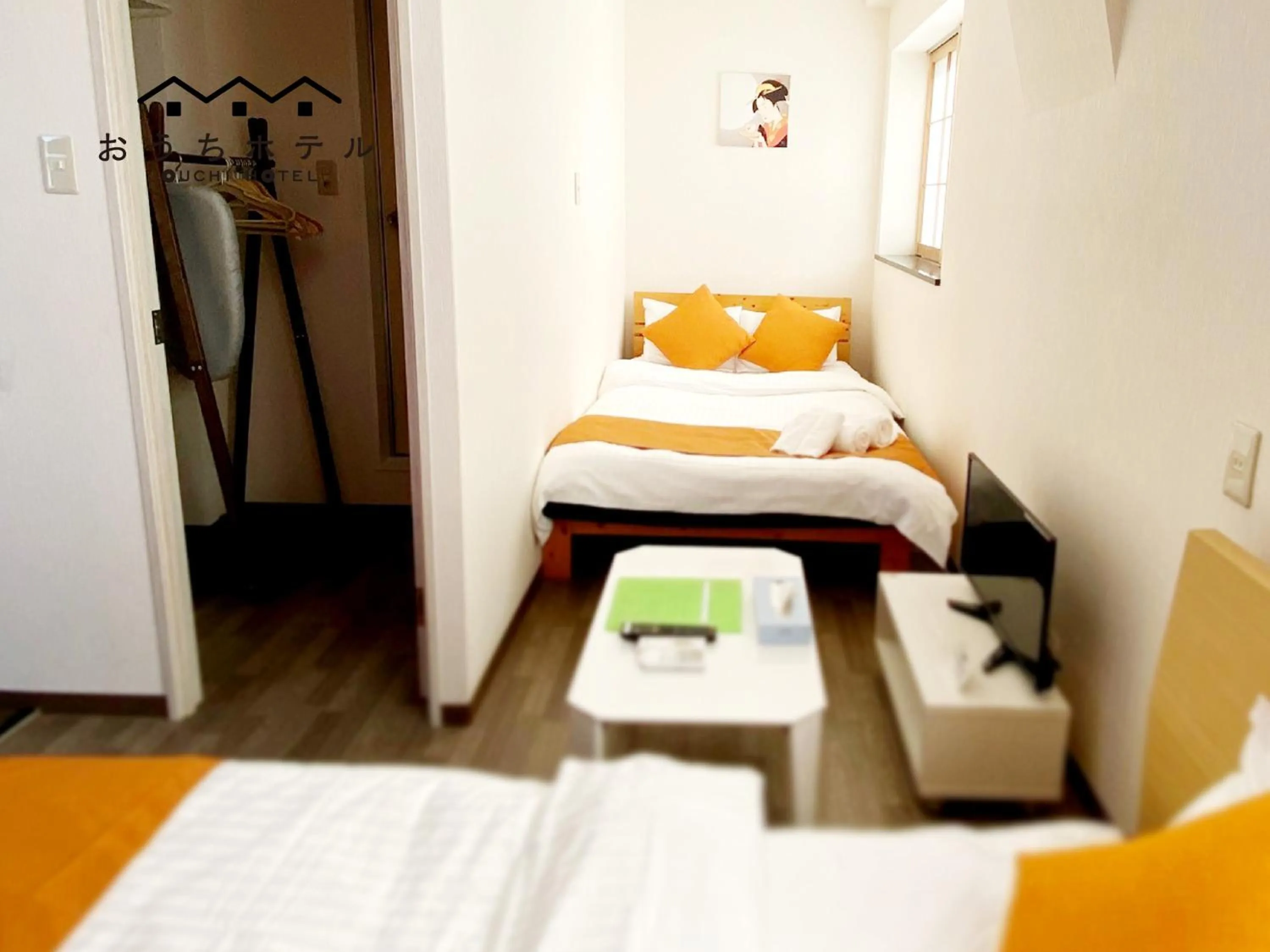 Bed in OUCHI HOTEL Yokogawa