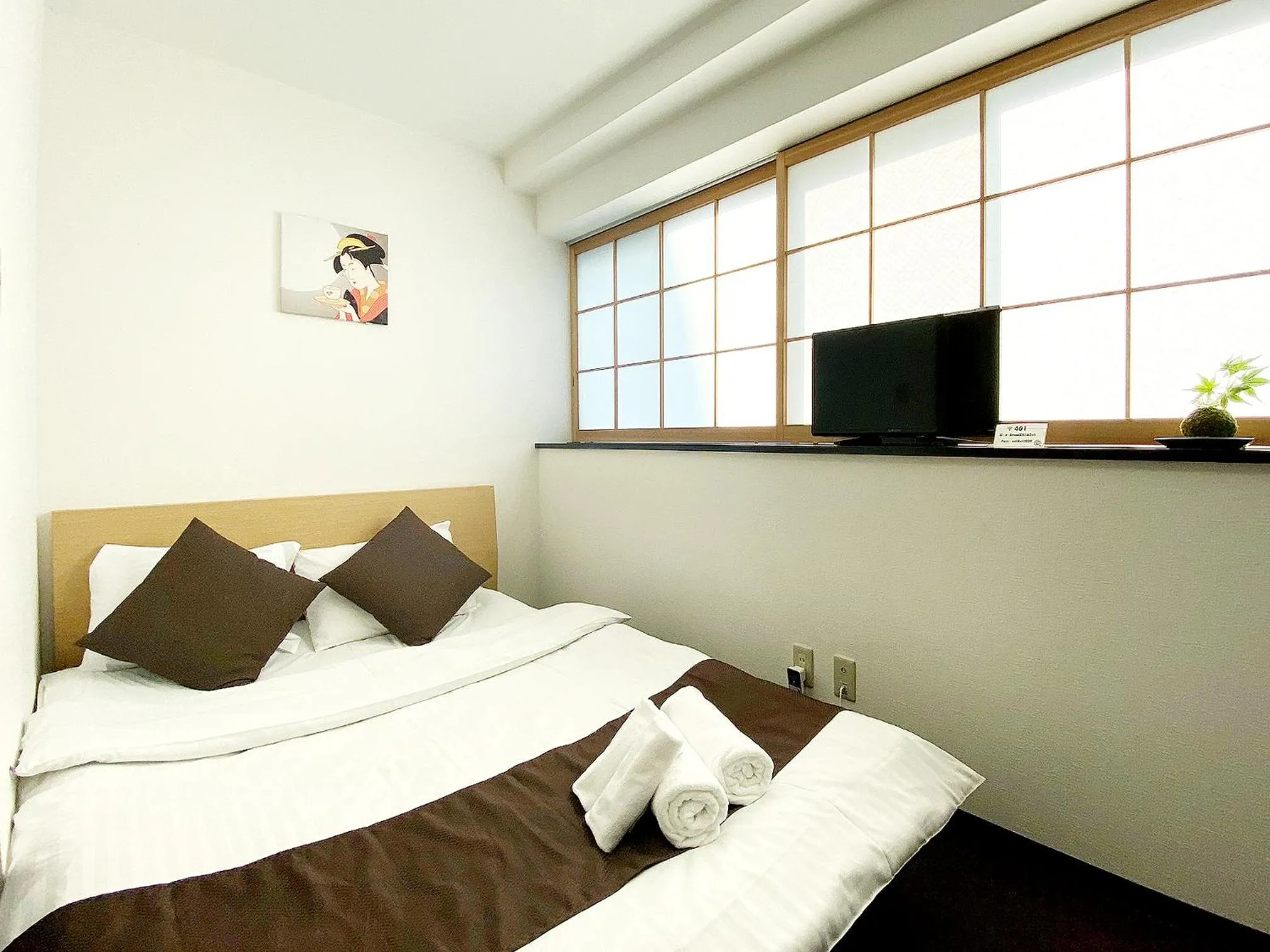 Bed in OUCHI HOTEL Yokogawa