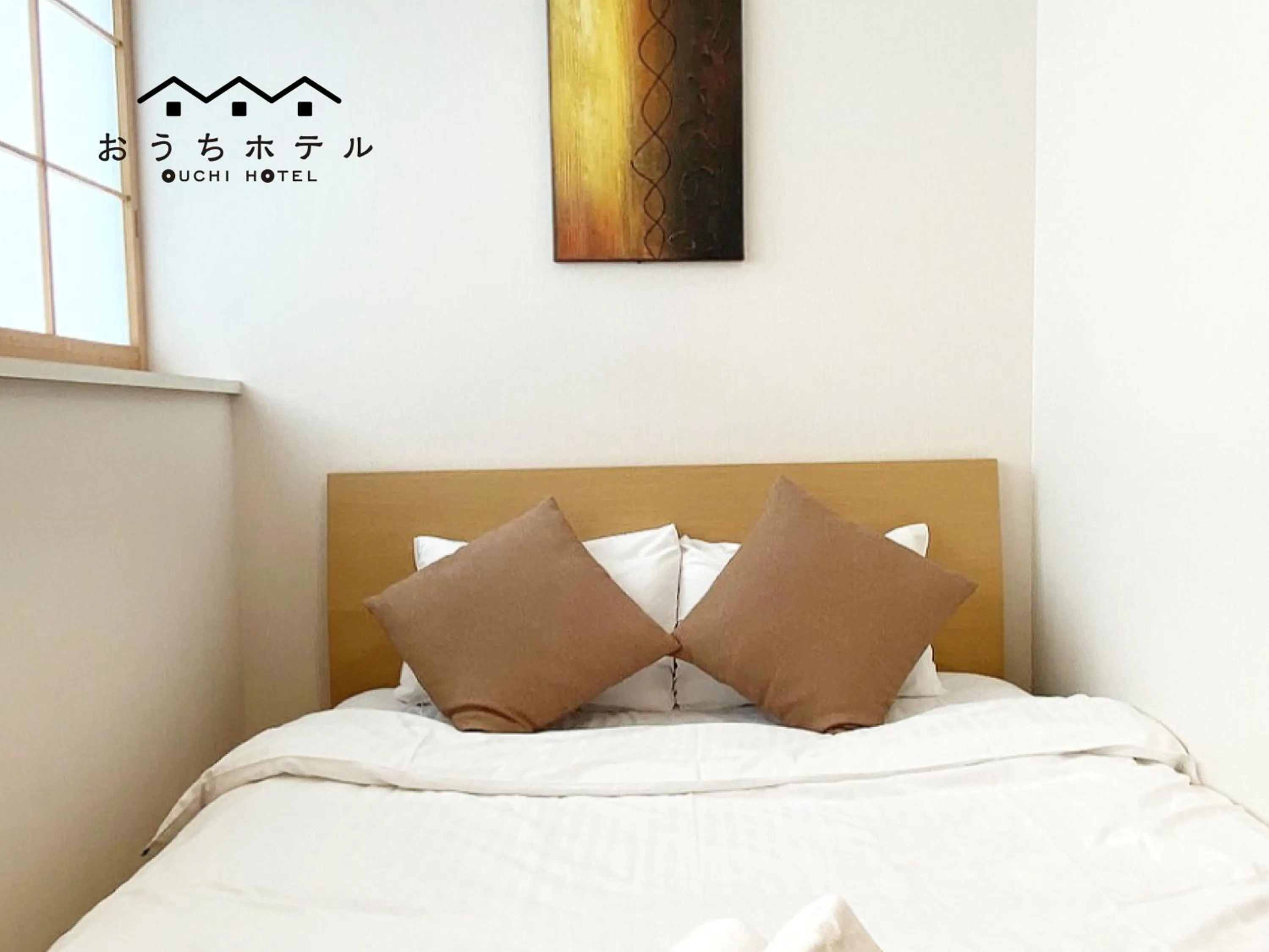 Bed in OUCHI HOTEL Yokogawa