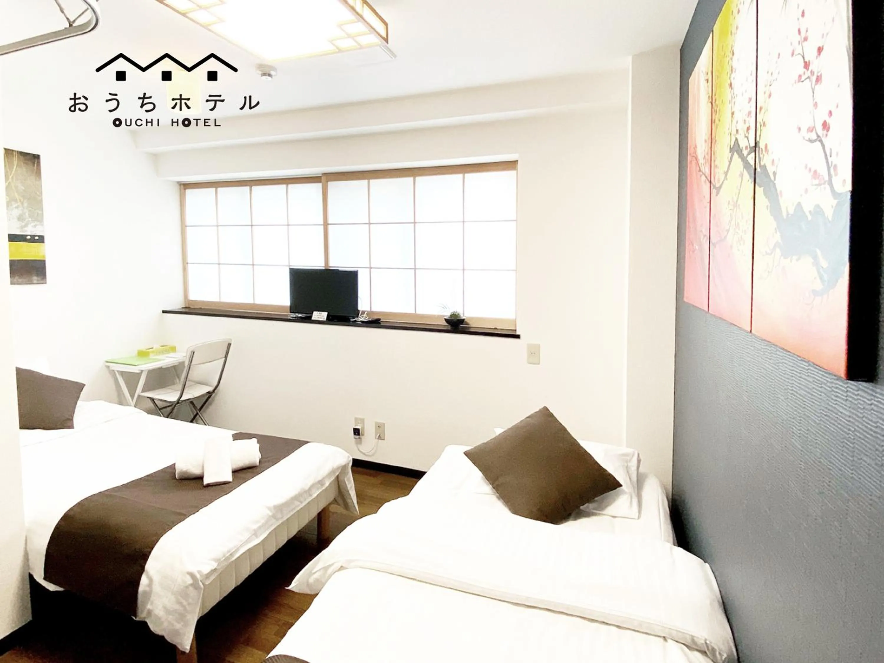 Bed in OUCHI HOTEL Yokogawa