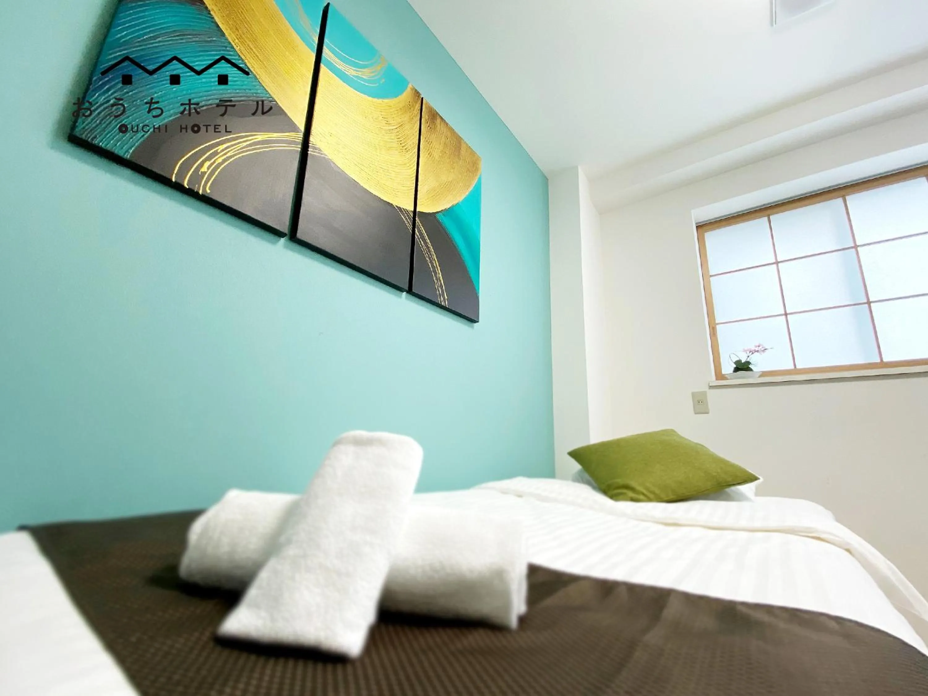 Bed in OUCHI HOTEL Yokogawa