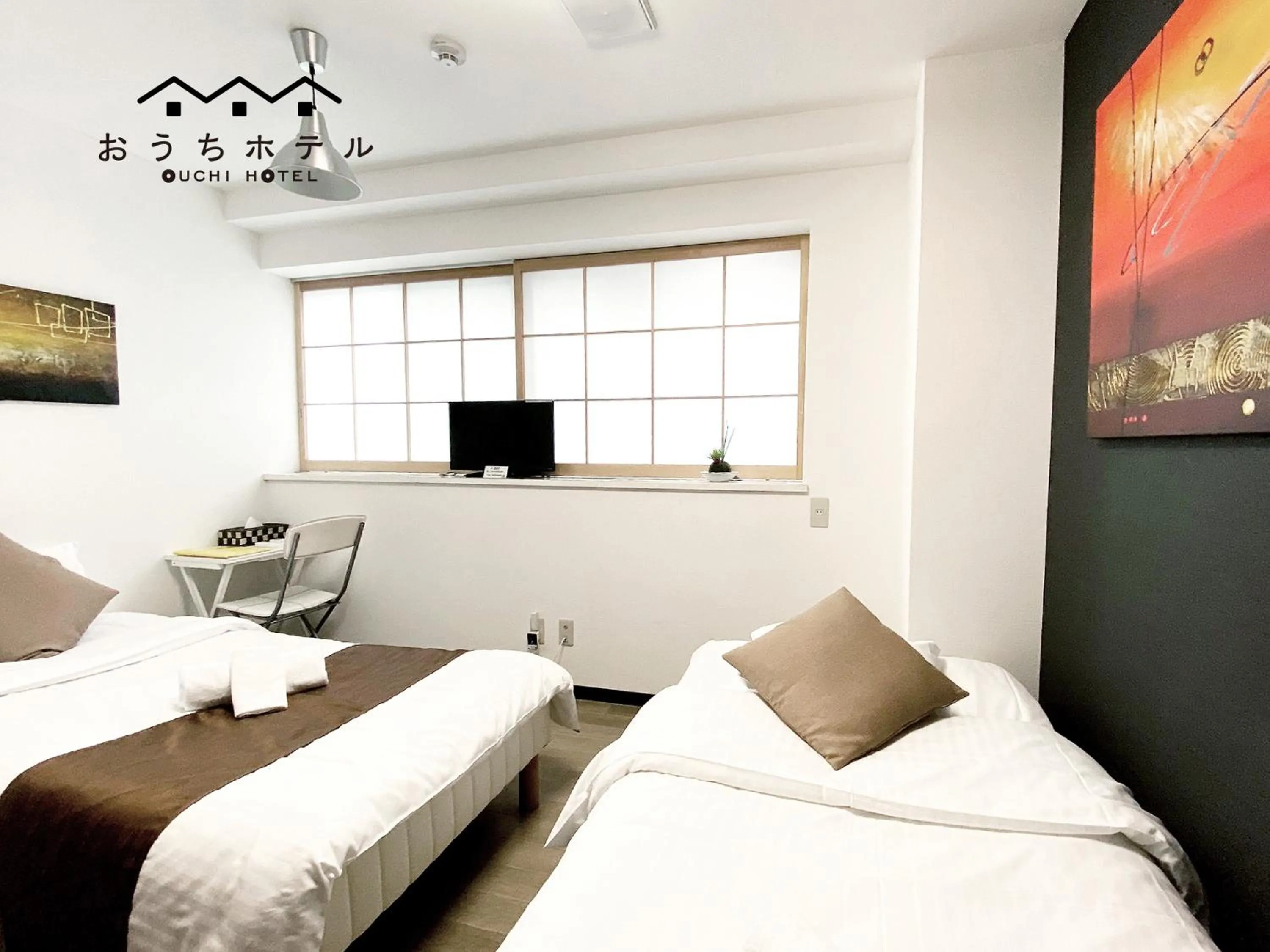 Bed in OUCHI HOTEL Yokogawa