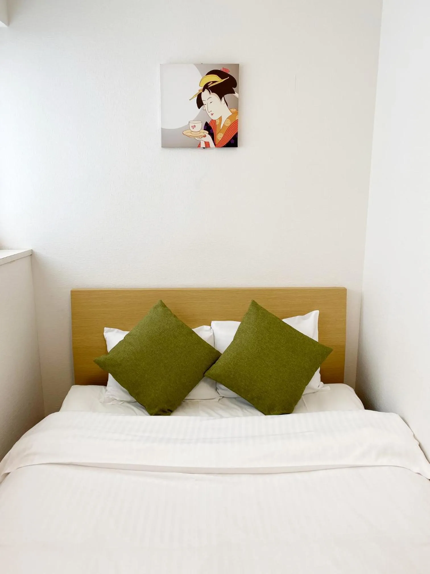 Bed in OUCHI HOTEL Yokogawa