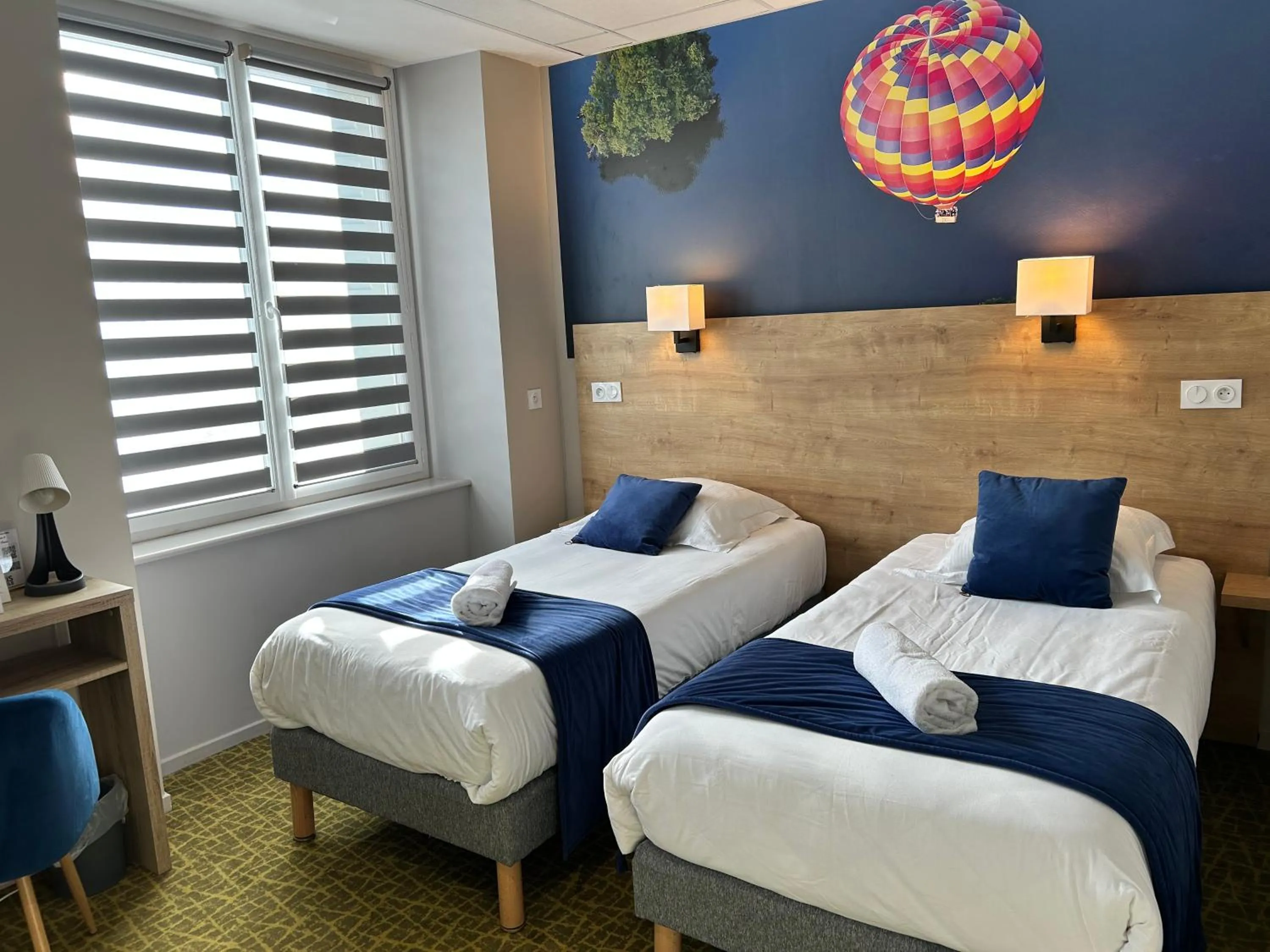 Bed in Logis Hôtel de Paris