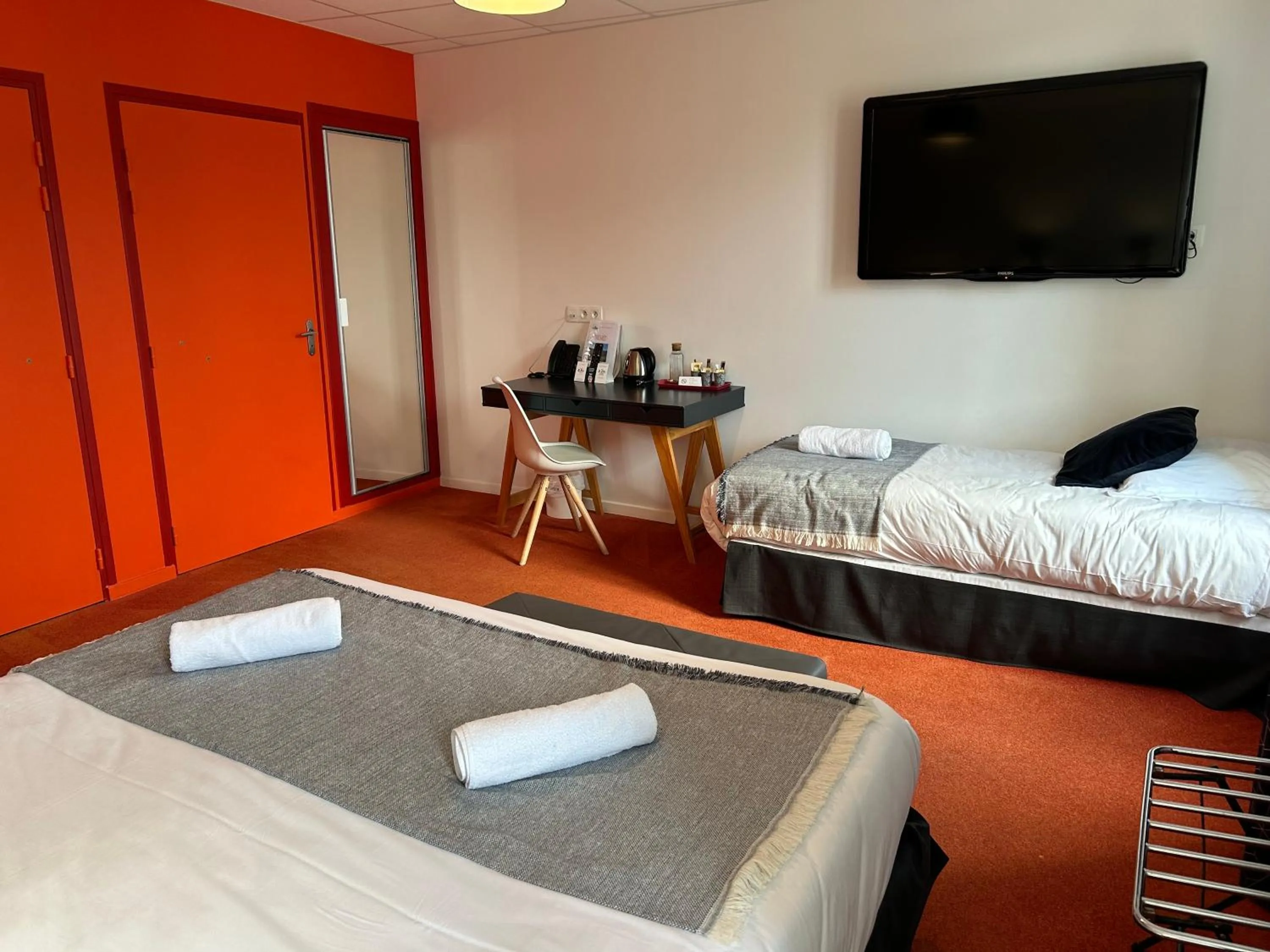 Bed in Logis Hôtel de Paris