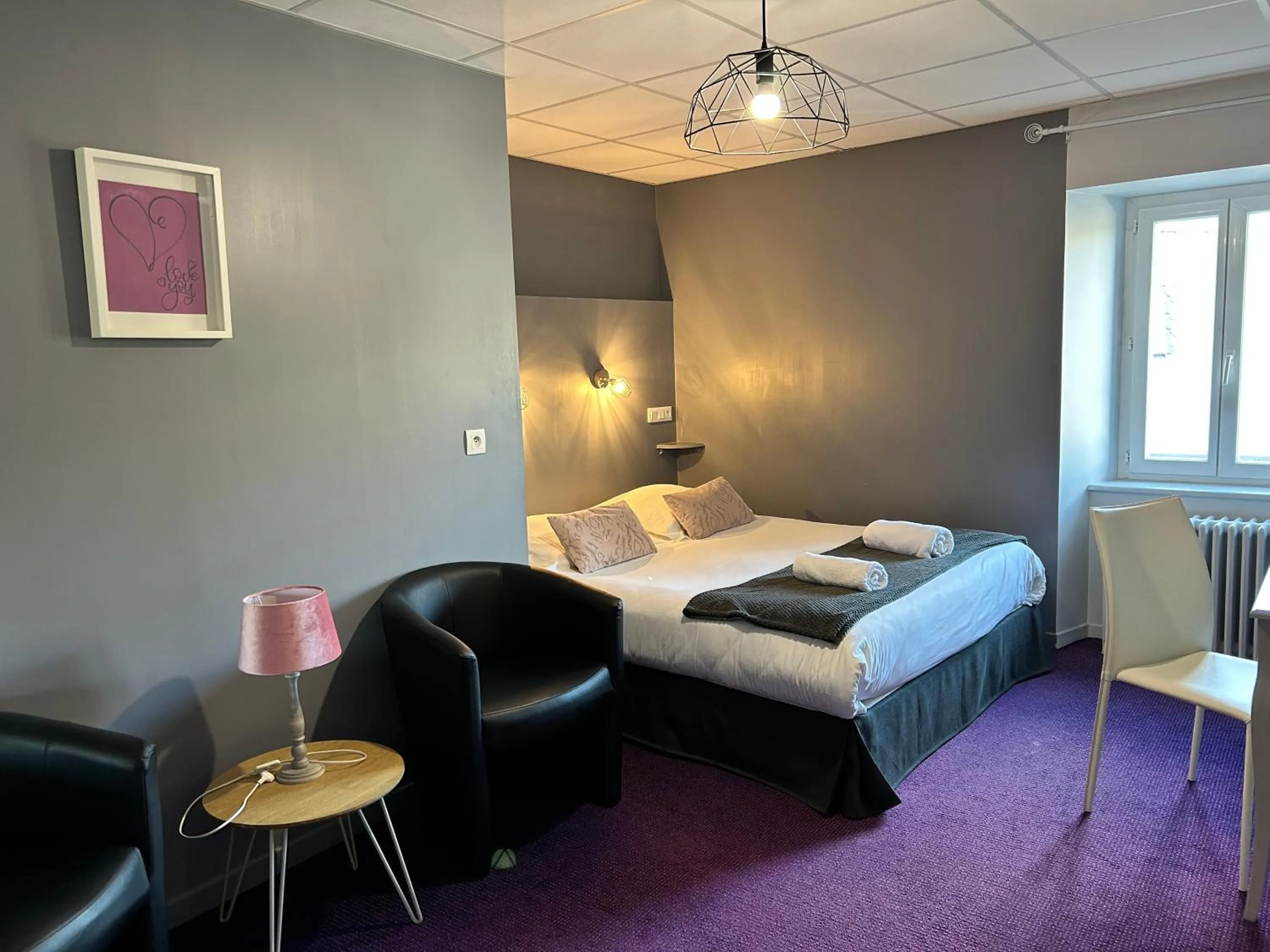 Bed in Logis Hôtel de Paris