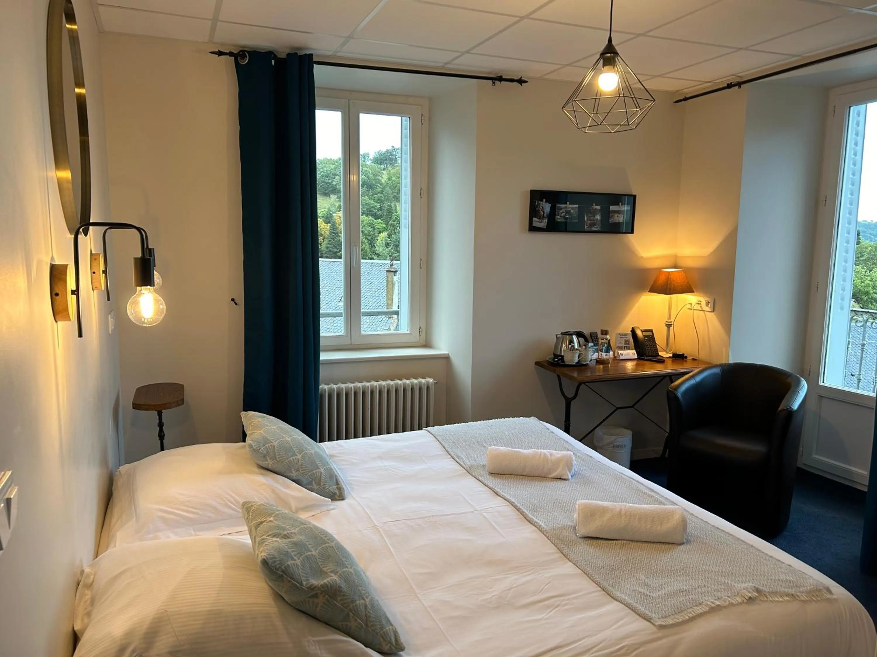 Bed in Logis Hôtel de Paris