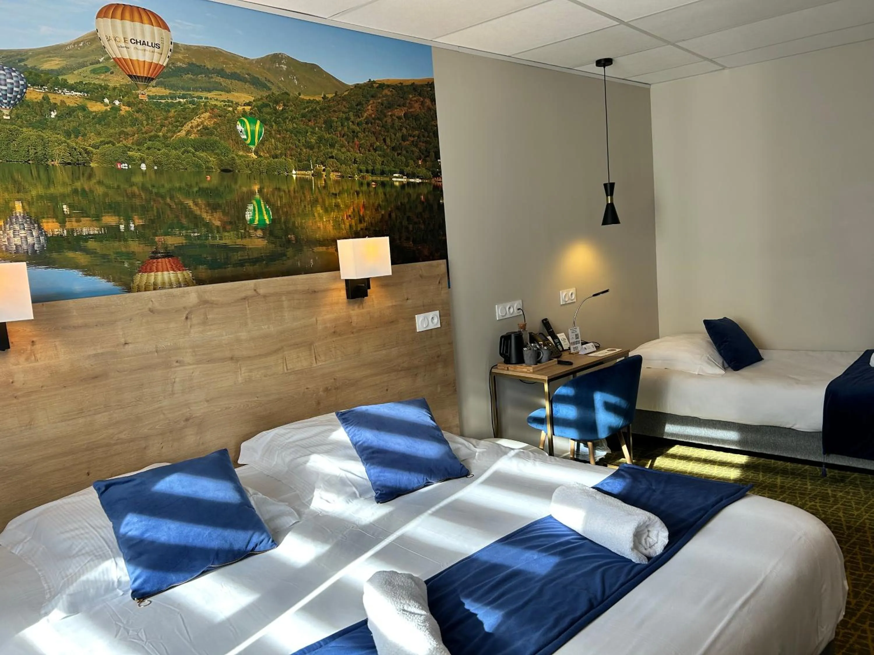 Bed in Logis Hôtel de Paris