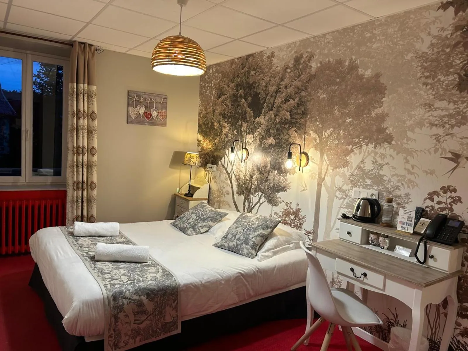 Bed in Logis Hôtel de Paris