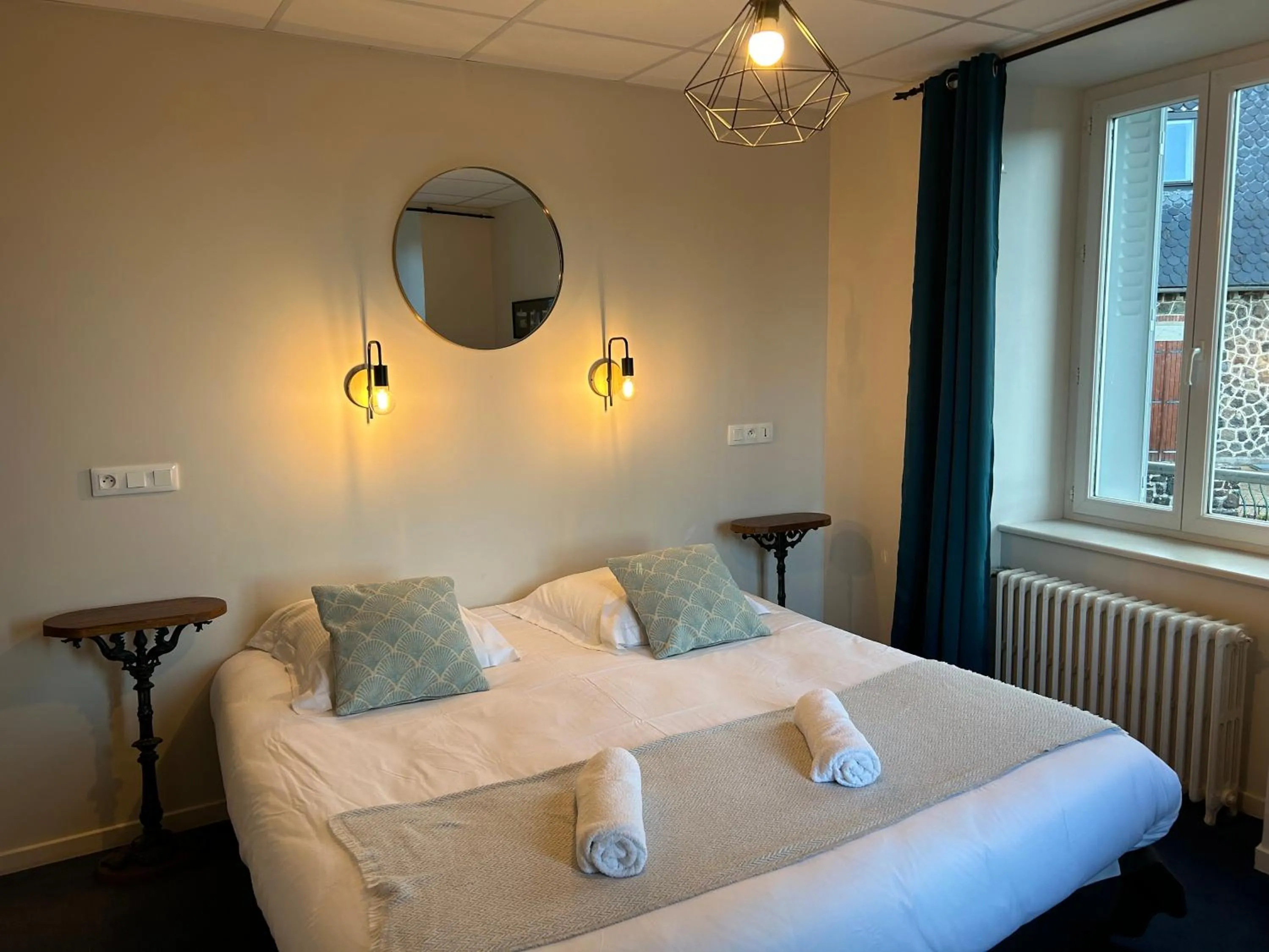 Bed in Logis Hôtel de Paris