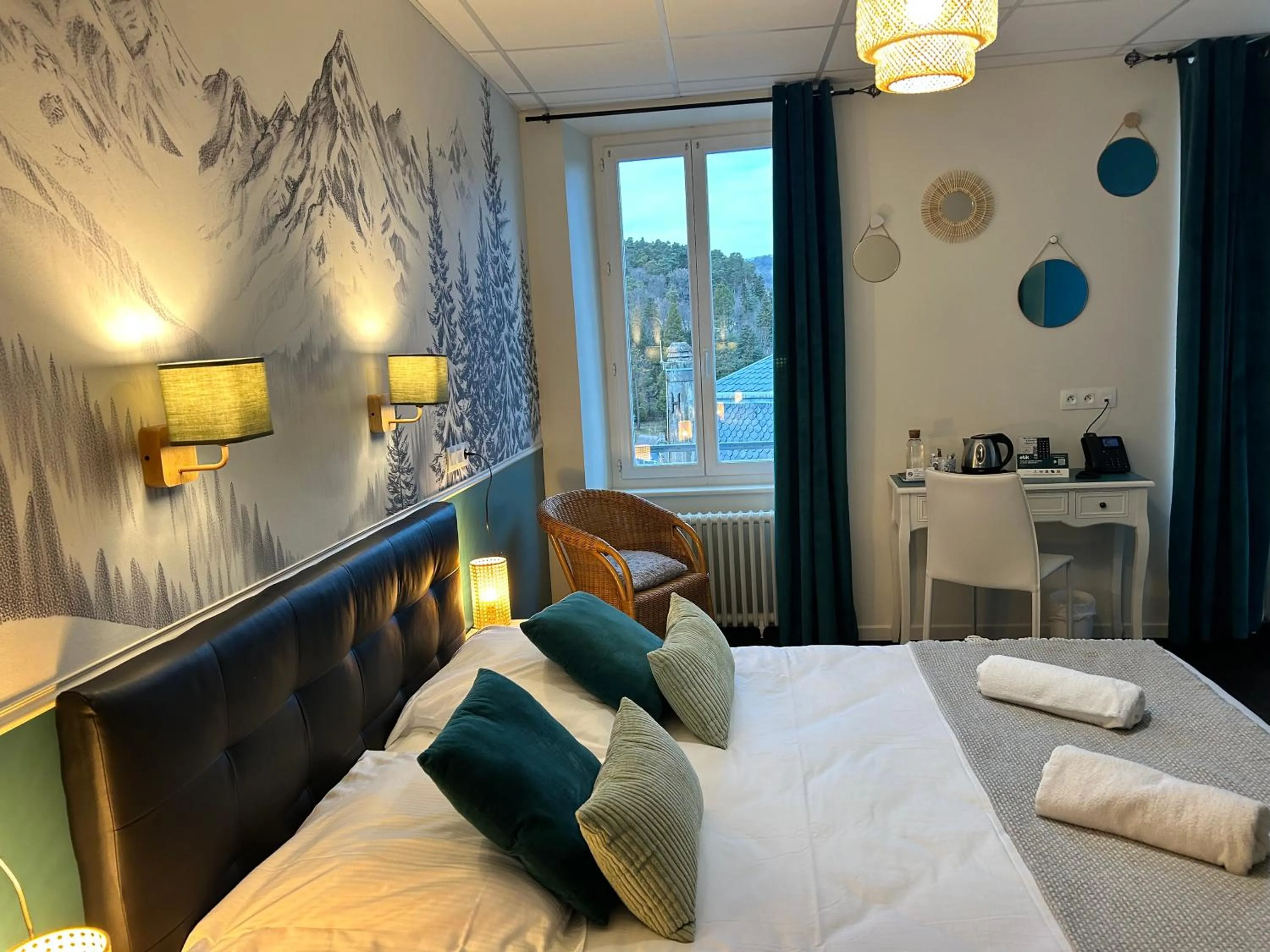 Bed in Logis Hôtel de Paris