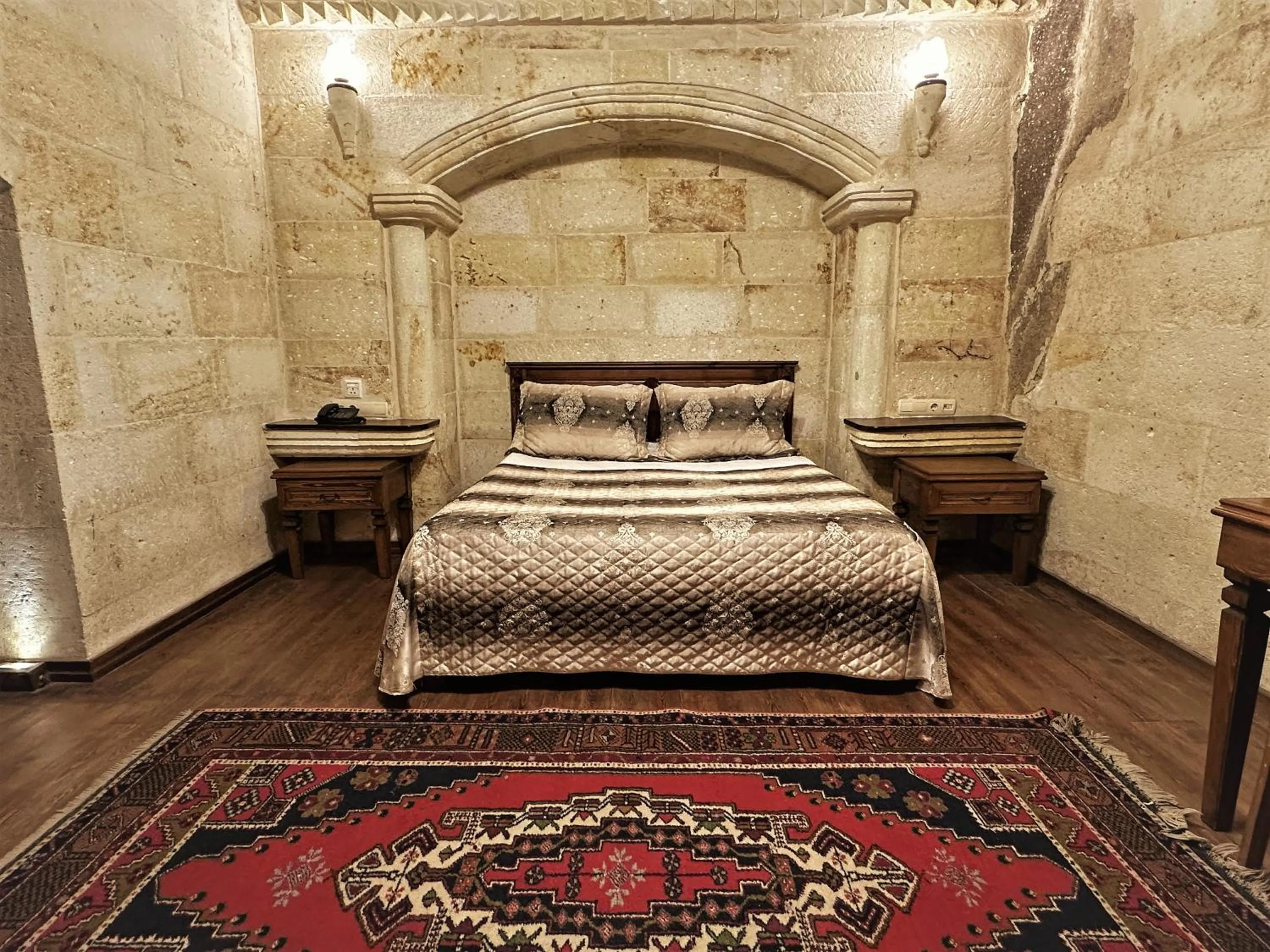 Bed in Stone House Cave Hotel