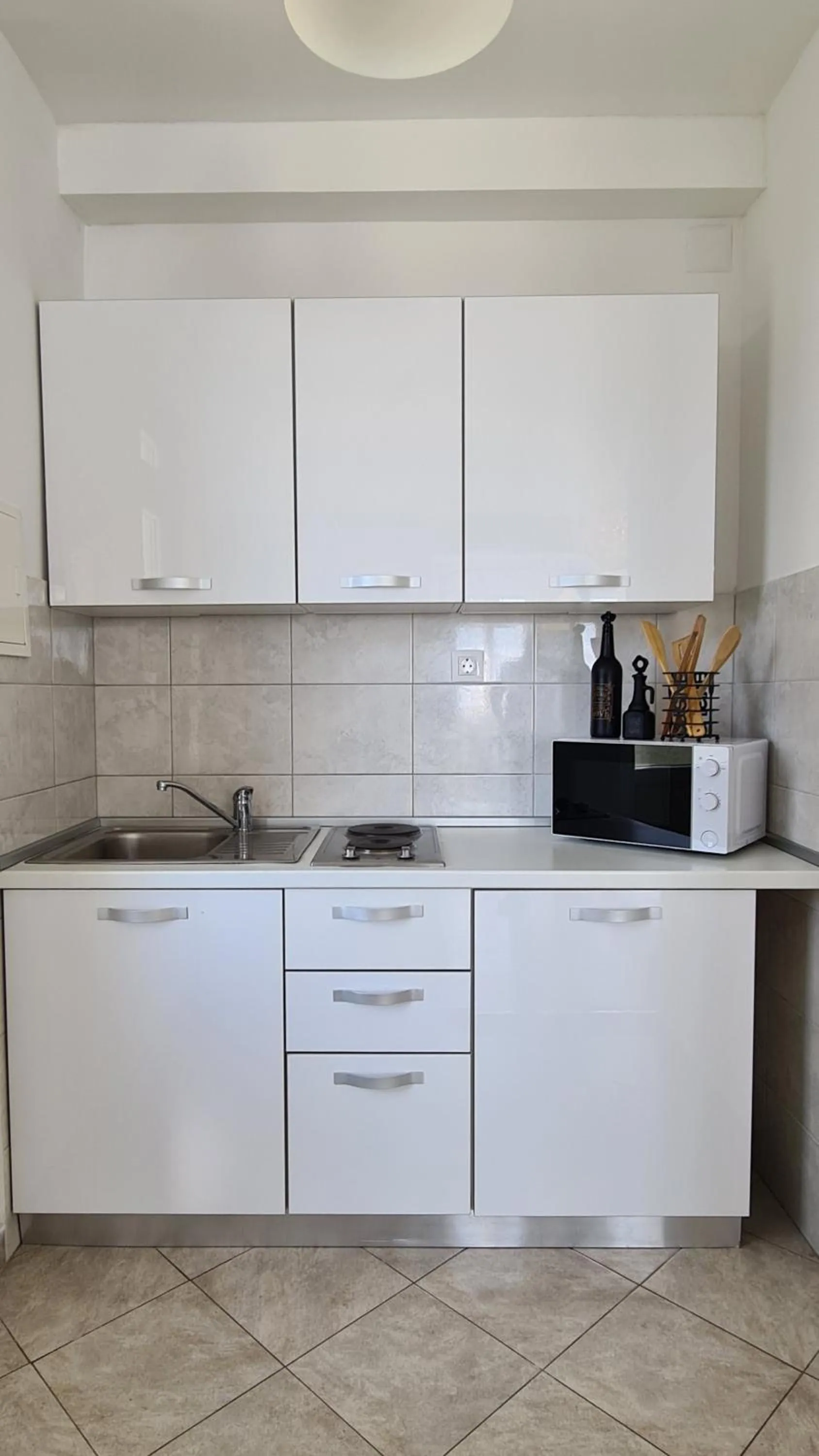 Kitchen or kitchenette in Cin&Co Central Apartments