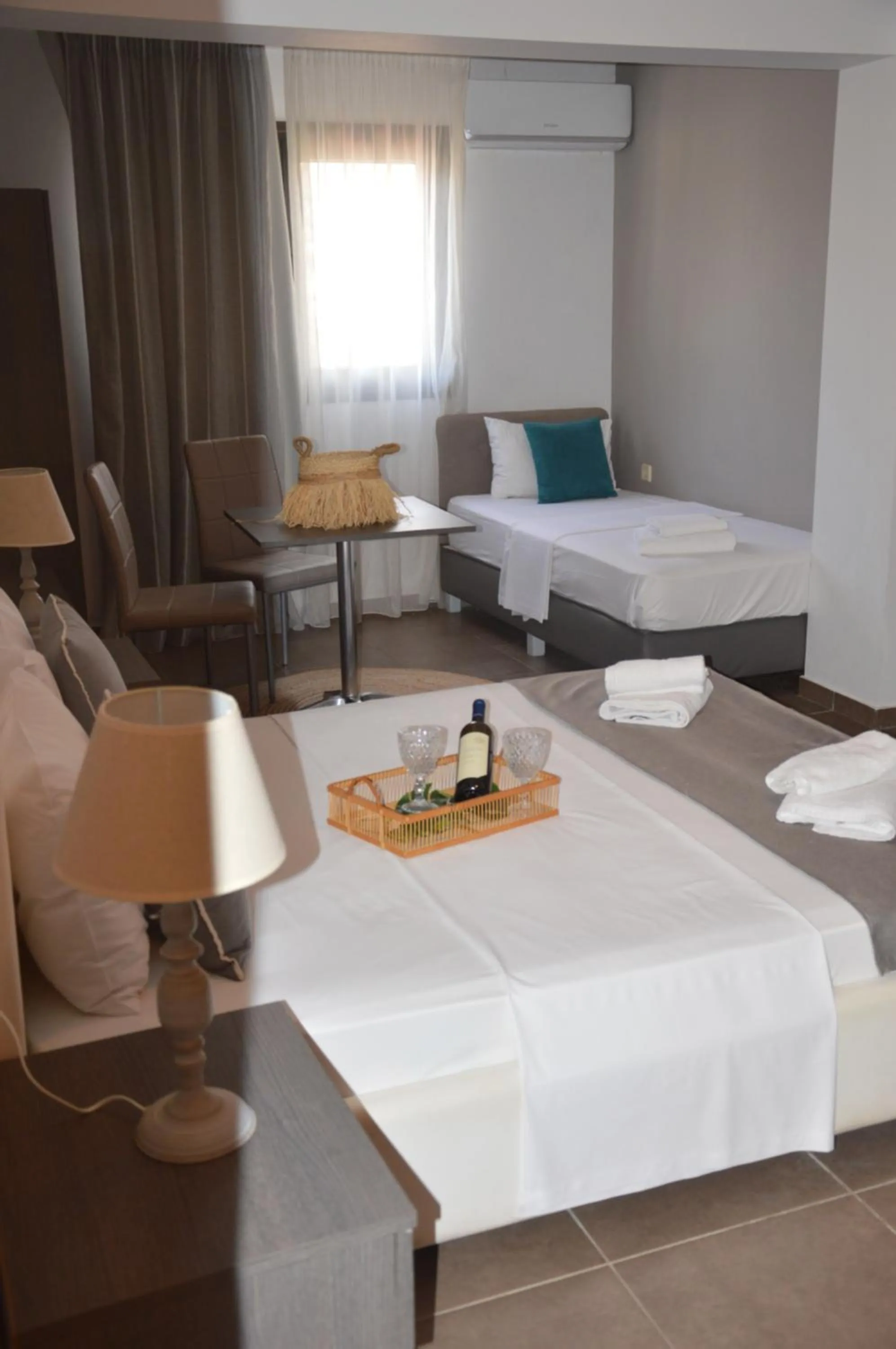 Bed in Aqua Mare Sea Side Rooms