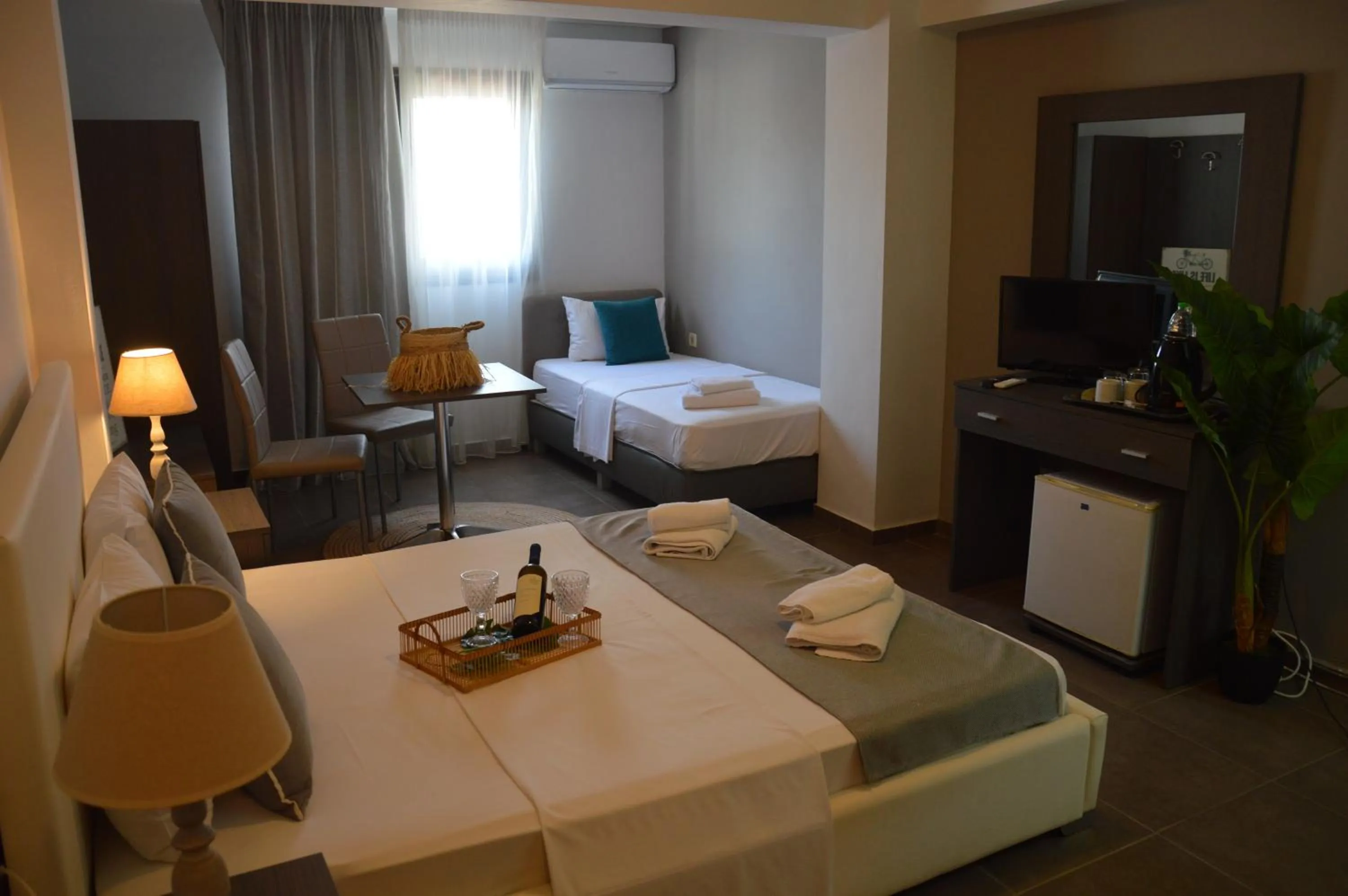 Bed in Aqua Mare Sea Side Rooms