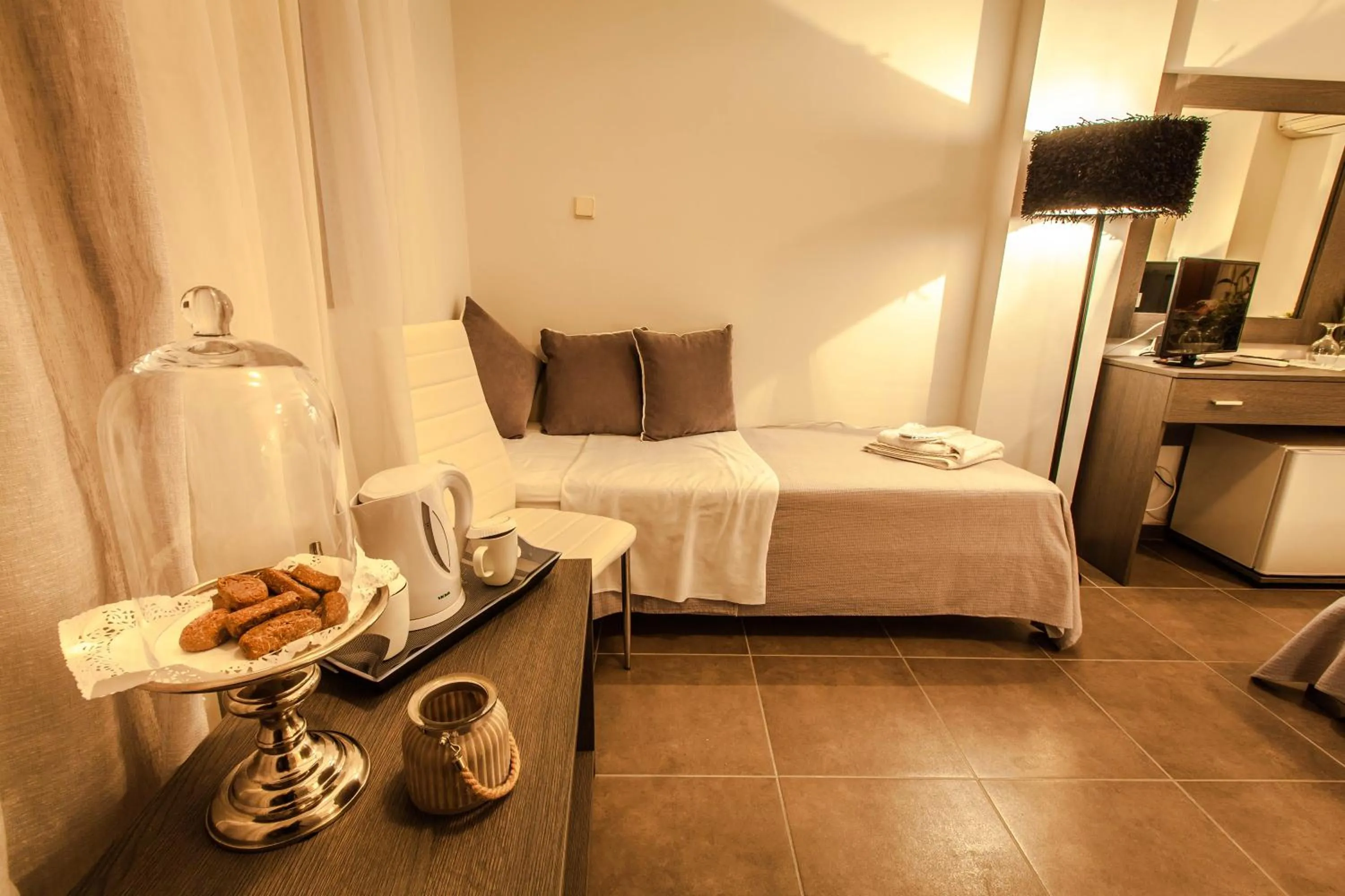 Bed in Aqua Mare Sea Side Rooms