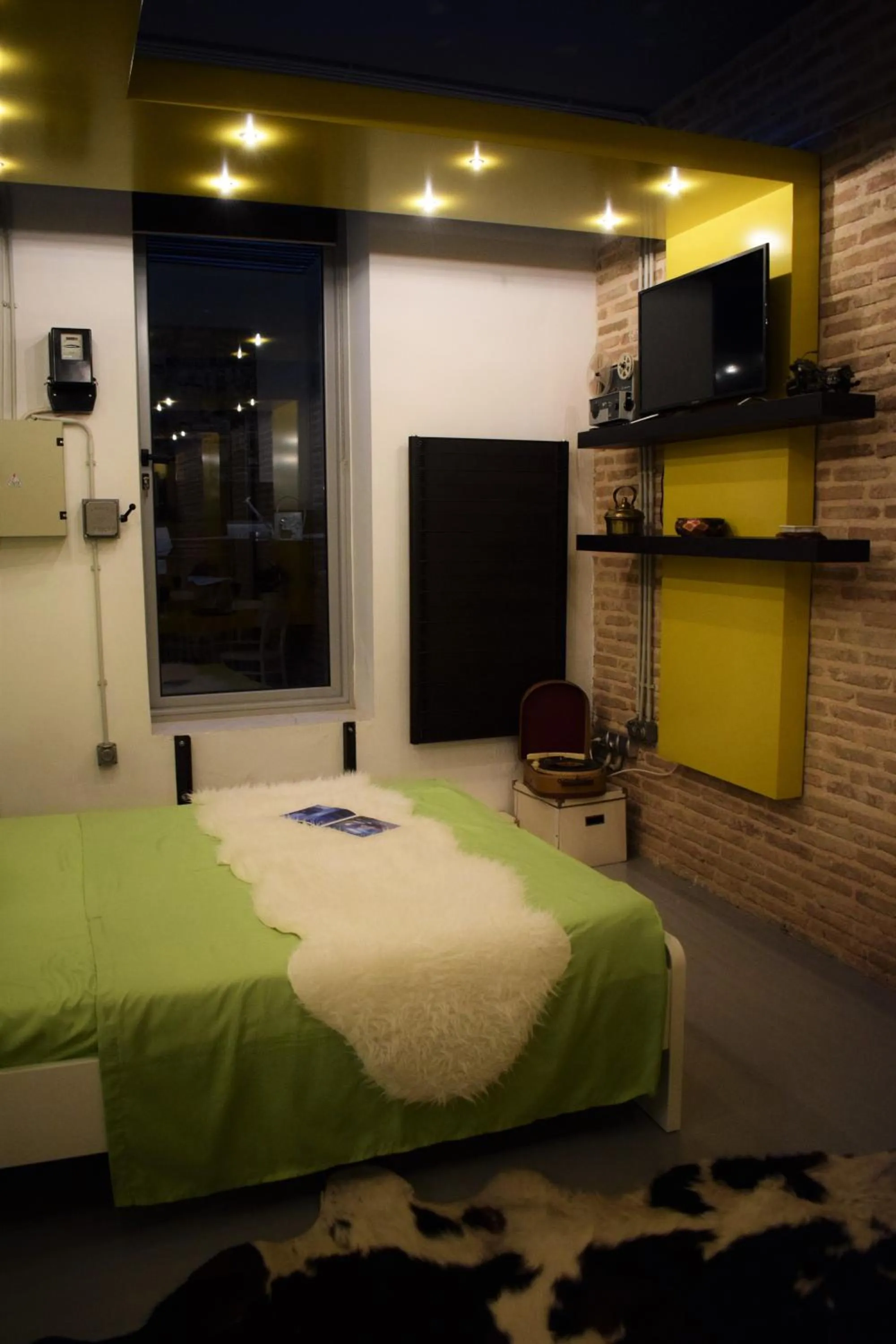 Bed in Panorama Penthouse & Studios