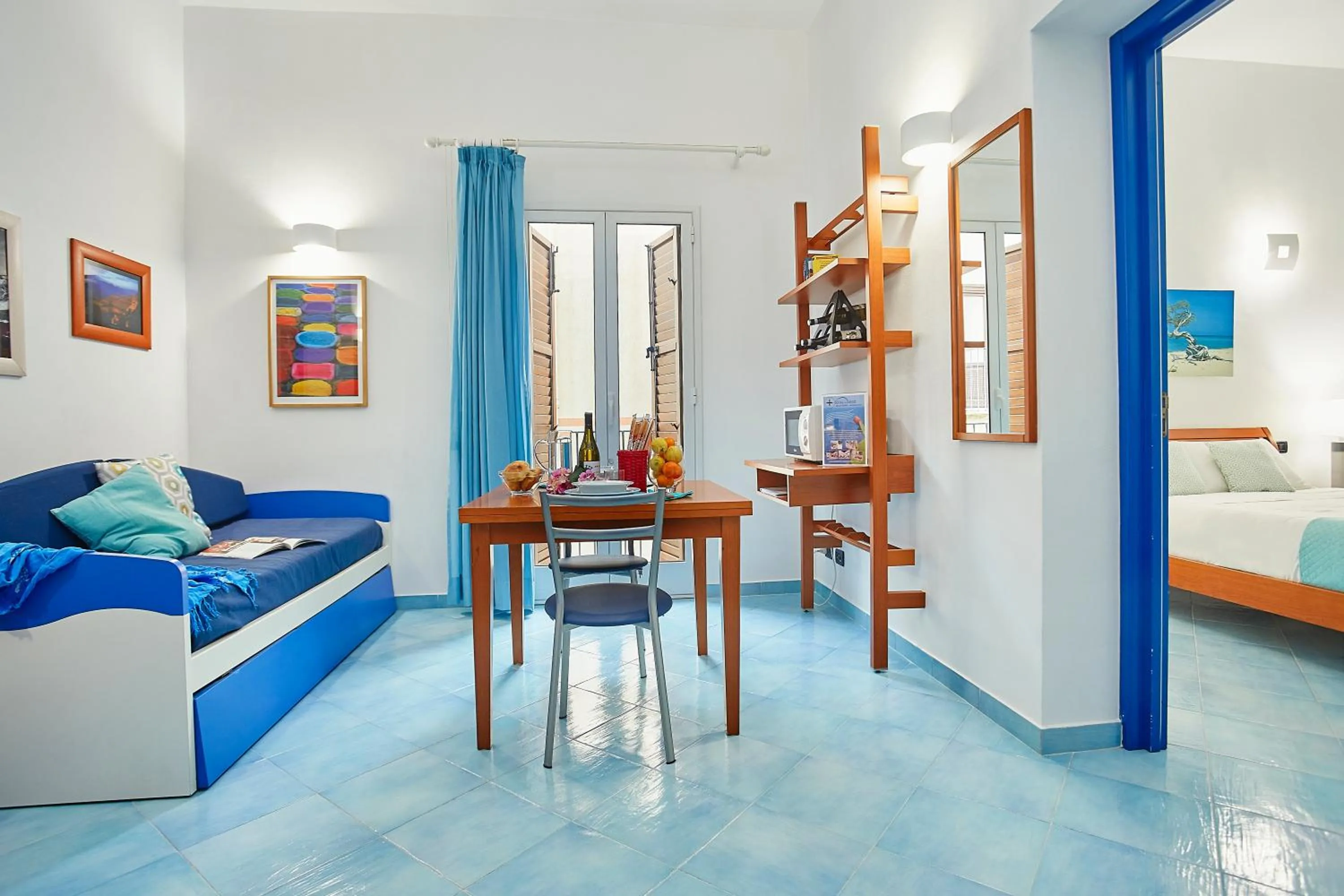 Living room, Bed in Appartamenti Rosa Dei Venti