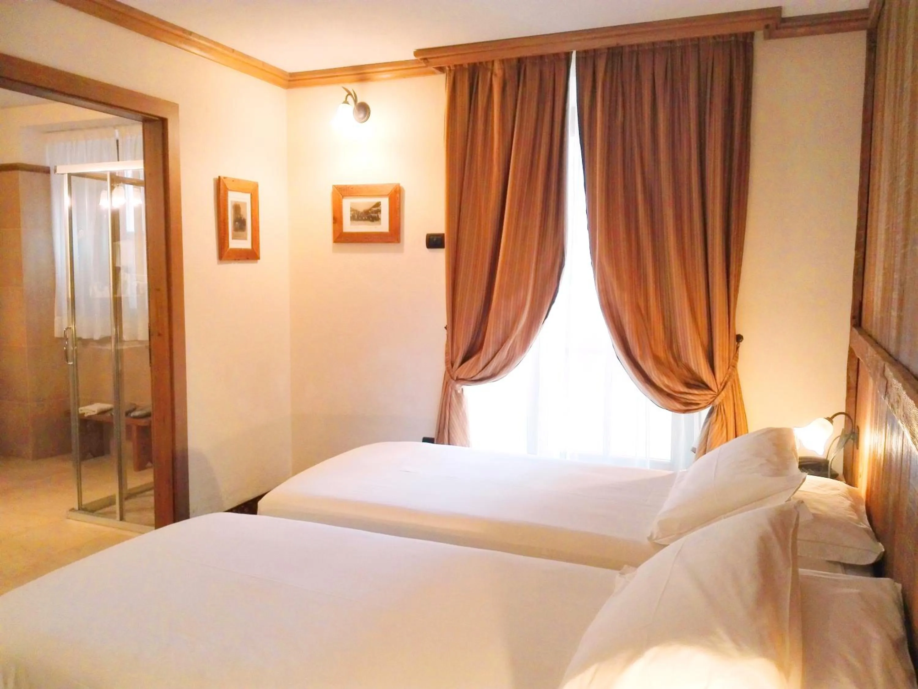 Bed in Le Miramonti Hotel Restaurant & Wellness