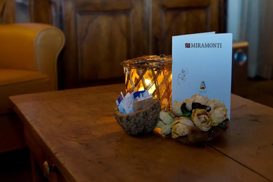 Communal lounge/ TV room in Le Miramonti Hotel Restaurant & Wellness