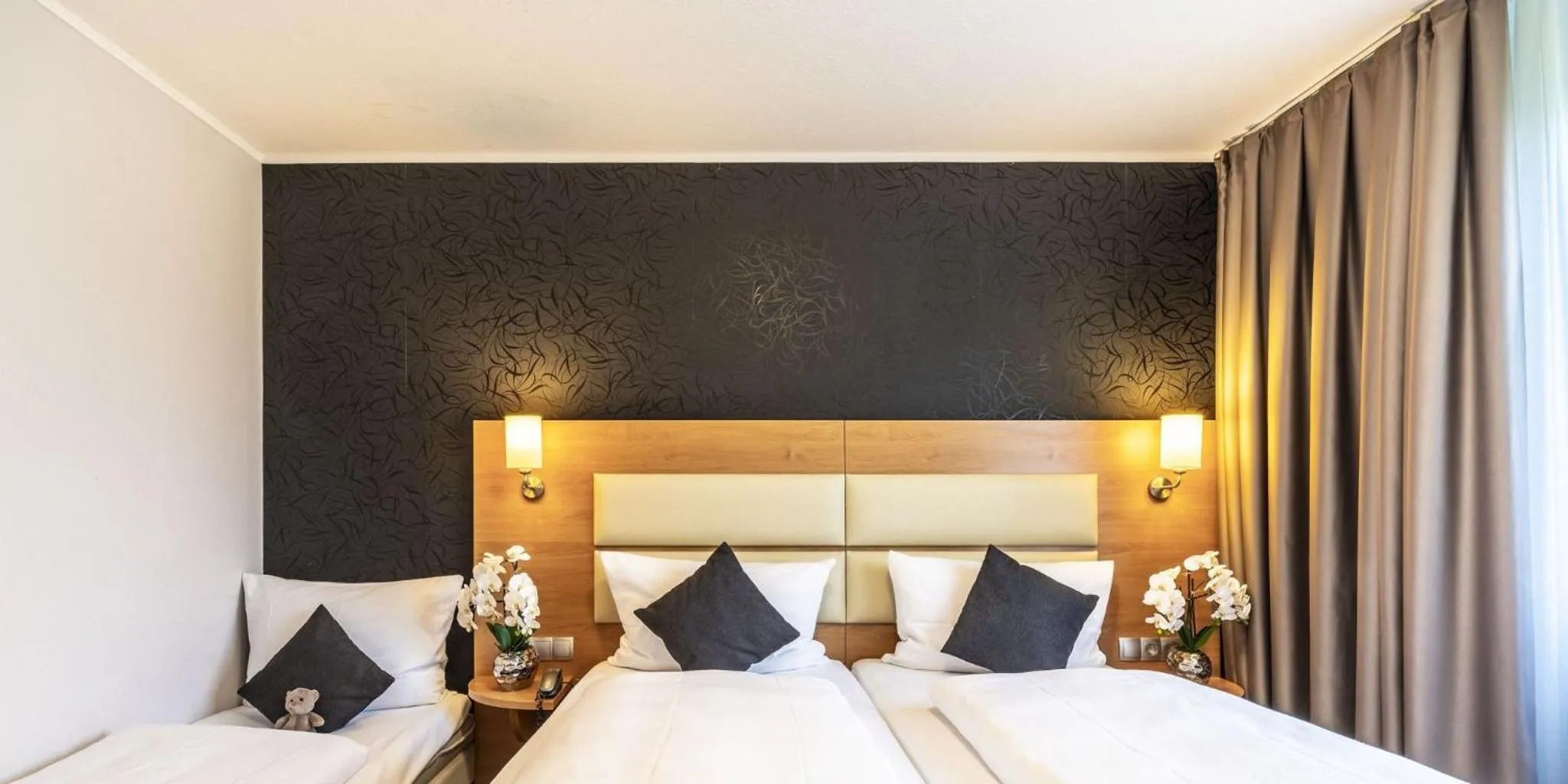 Bed in PLAZA INN Stuttgart Airport Messe