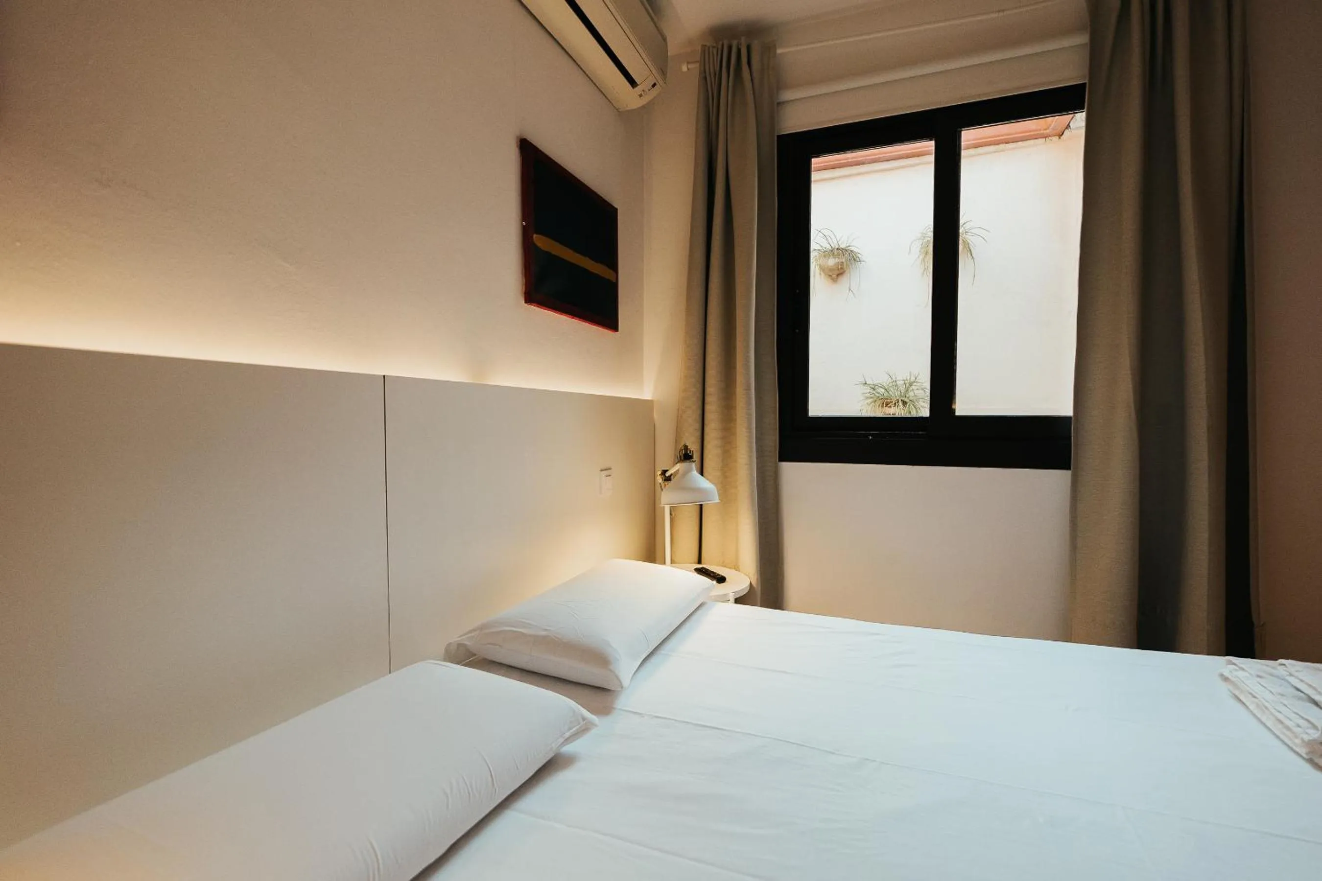 Bed in Ramblas Apartments