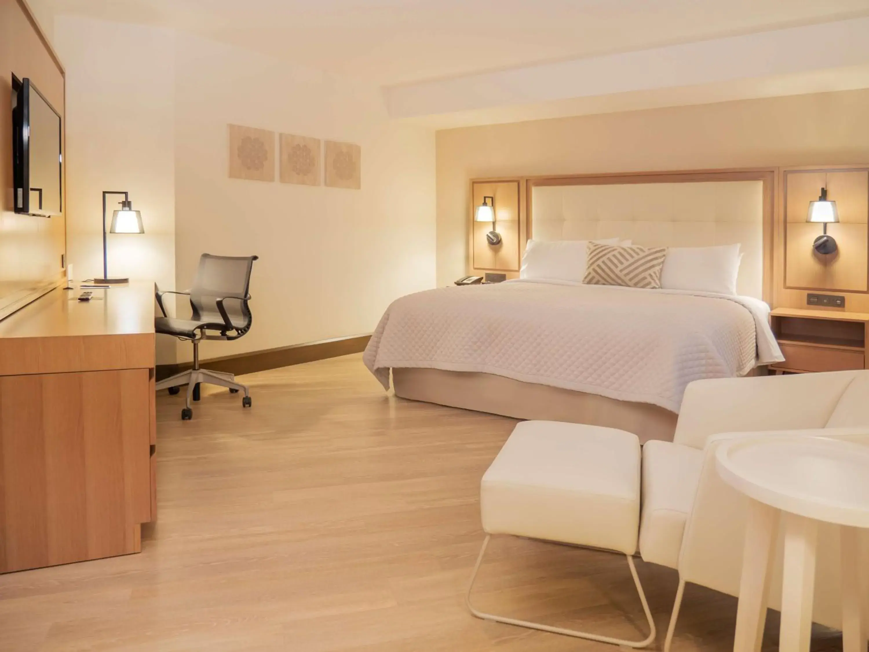 Junior King Suite with Seating Area in MS Milenium Monterrey Curio Collection by Hilton Junior King Suite with Seating Area in MS Milenium Monterrey Curio Collection by Hilton