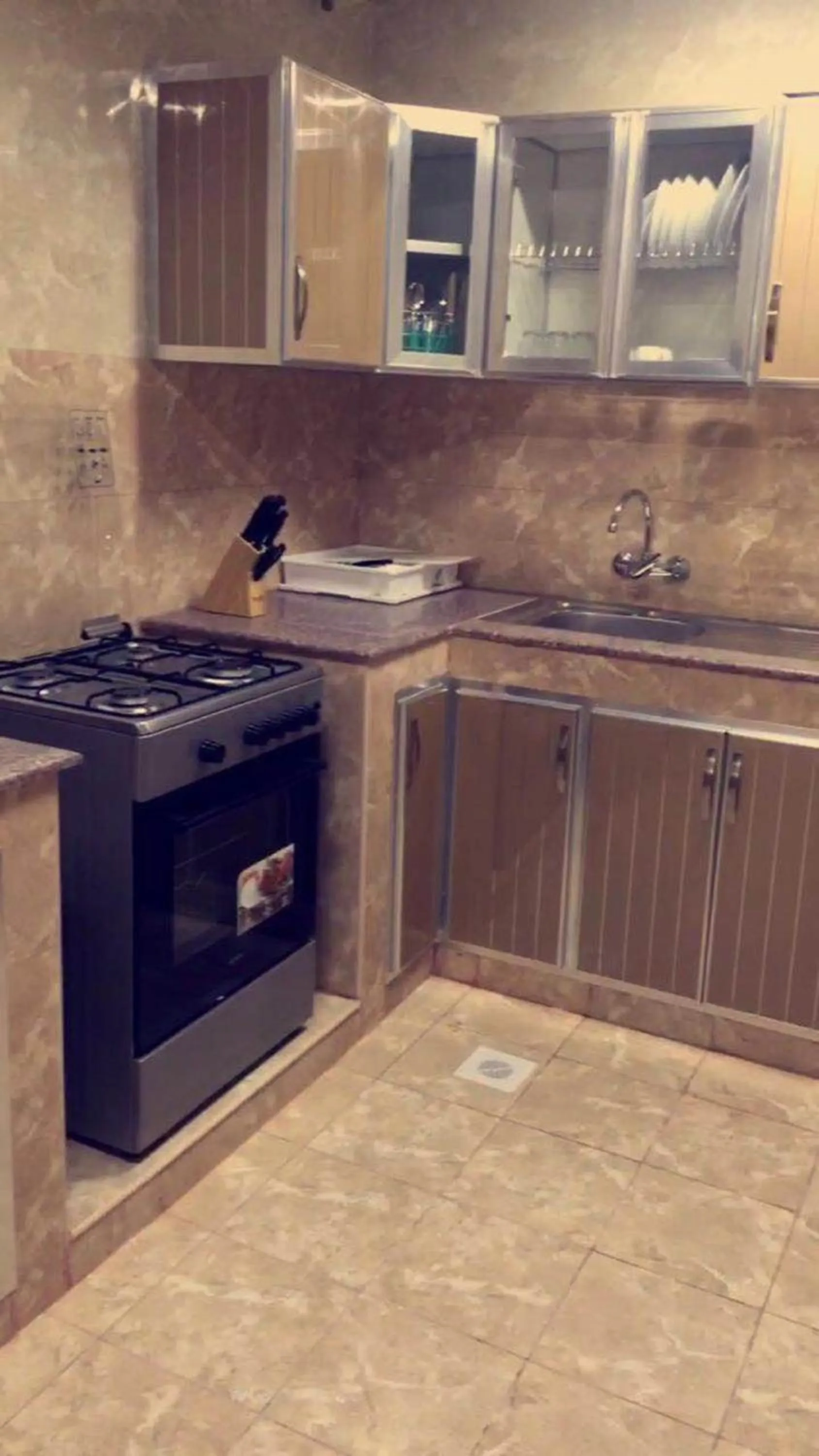 Kitchen or kitchenette in Al Noor Saadah Furnished Apartments