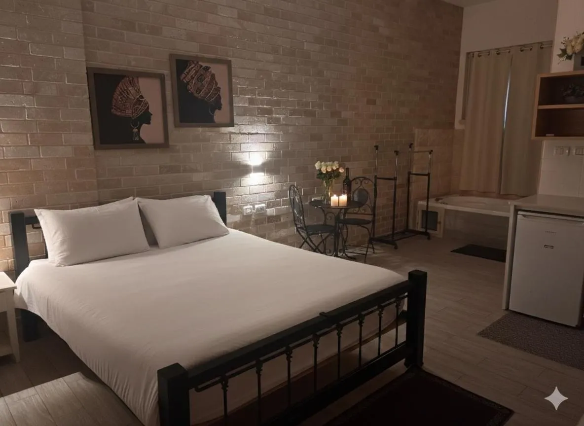 Bed in Zimmer BaSadot