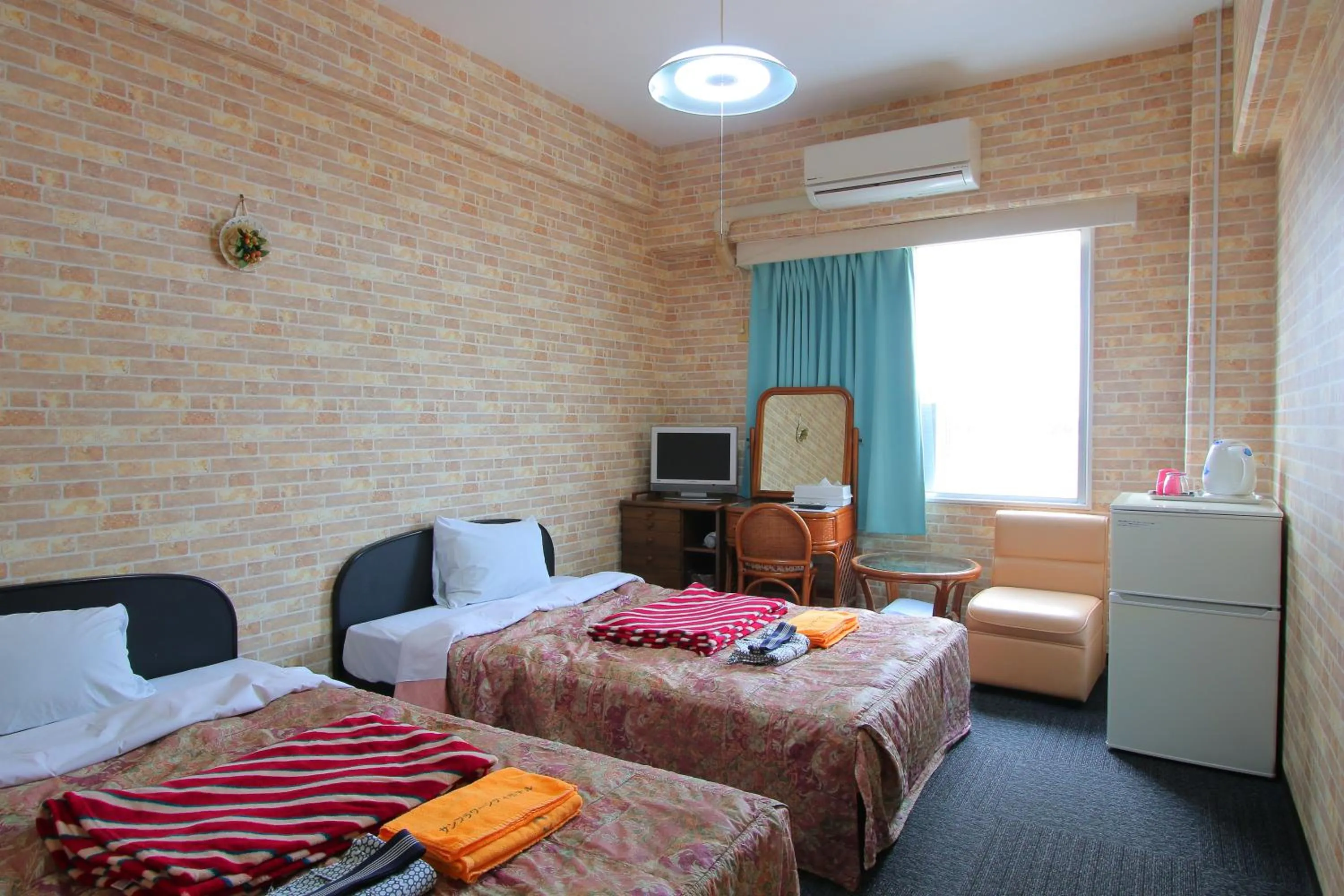 Bed in Sun Flower City Hotel