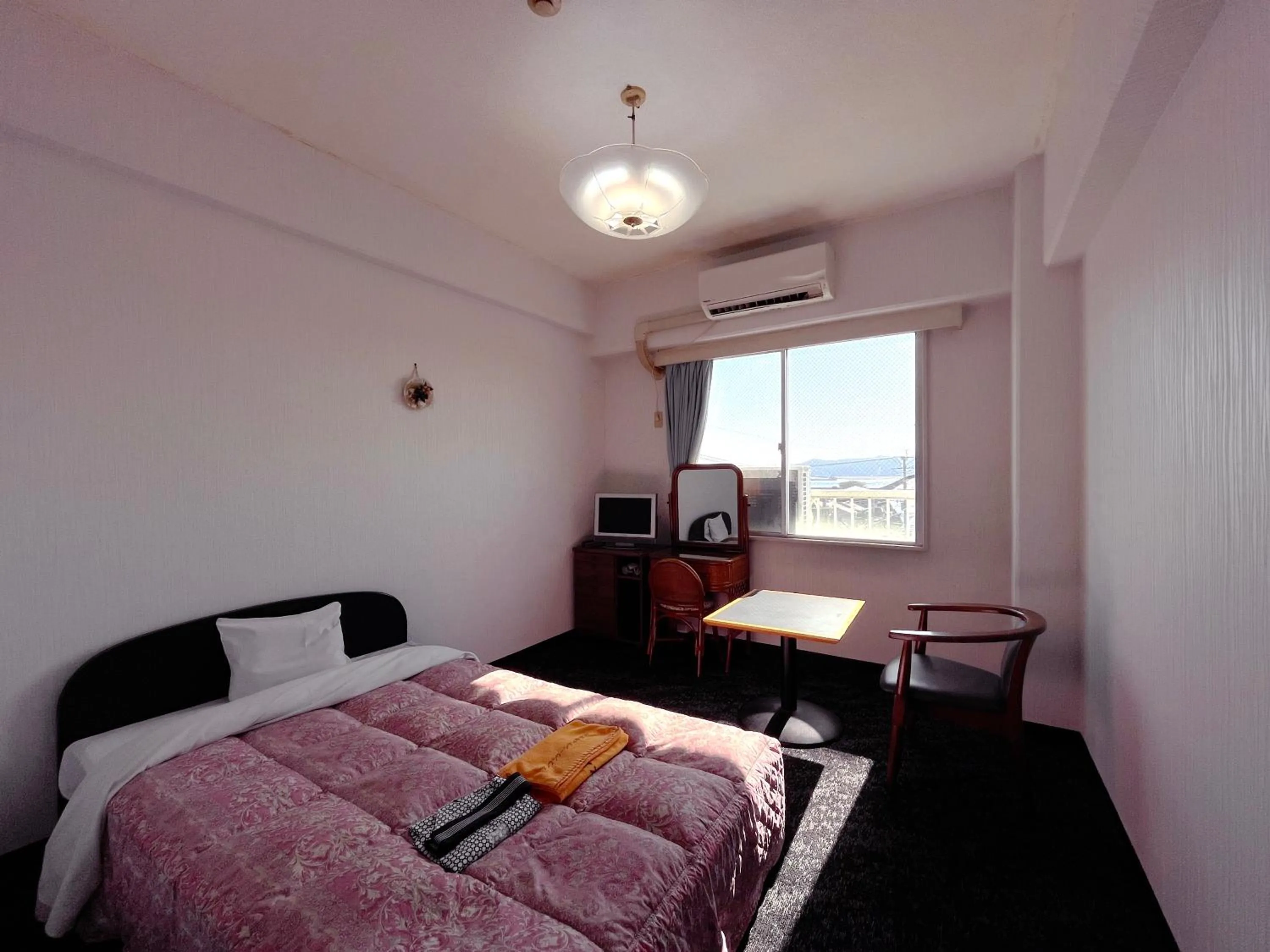 Bed in Sun Flower City Hotel