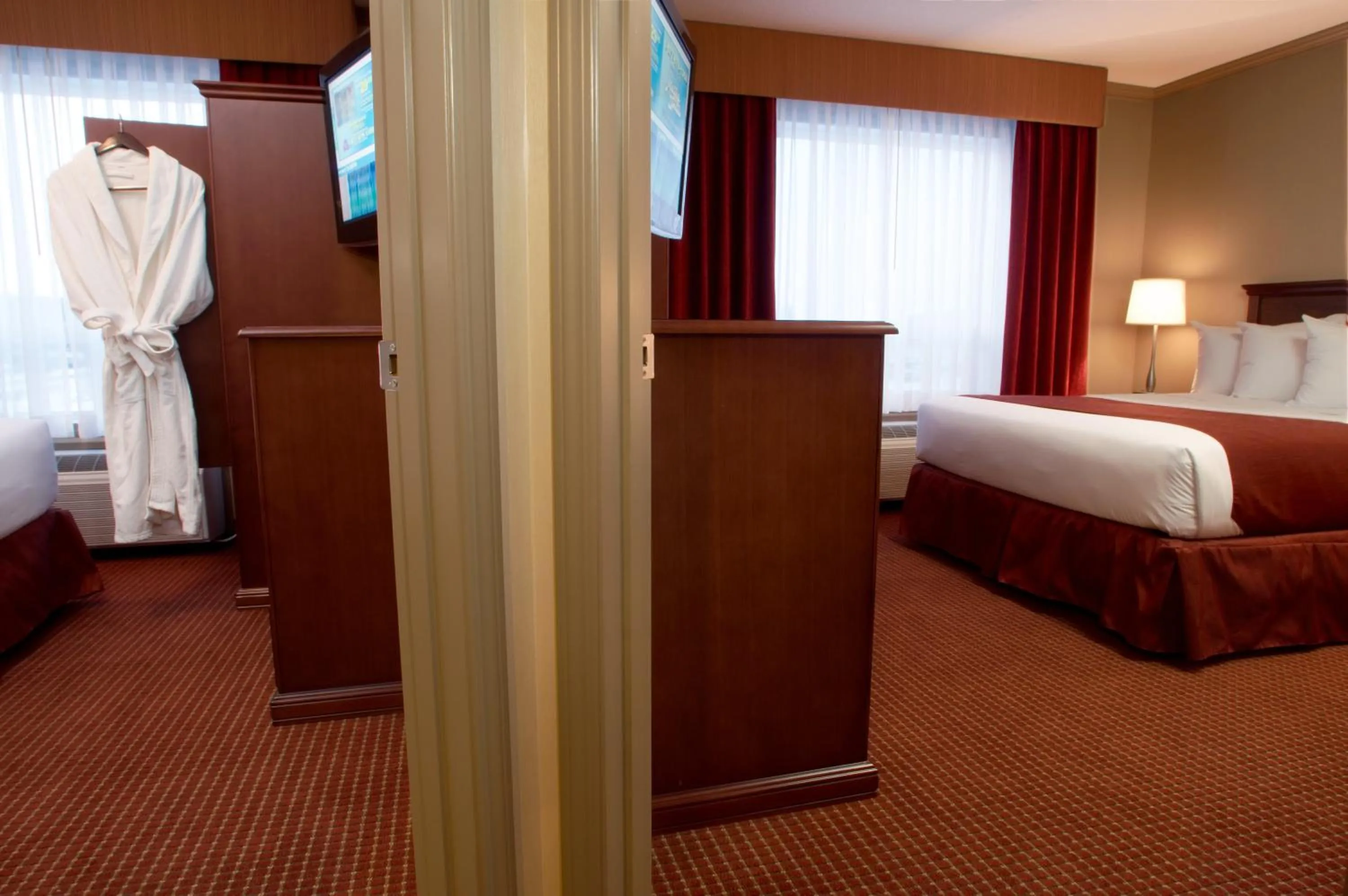 Guests, Bed in Merit Hotel & Suites